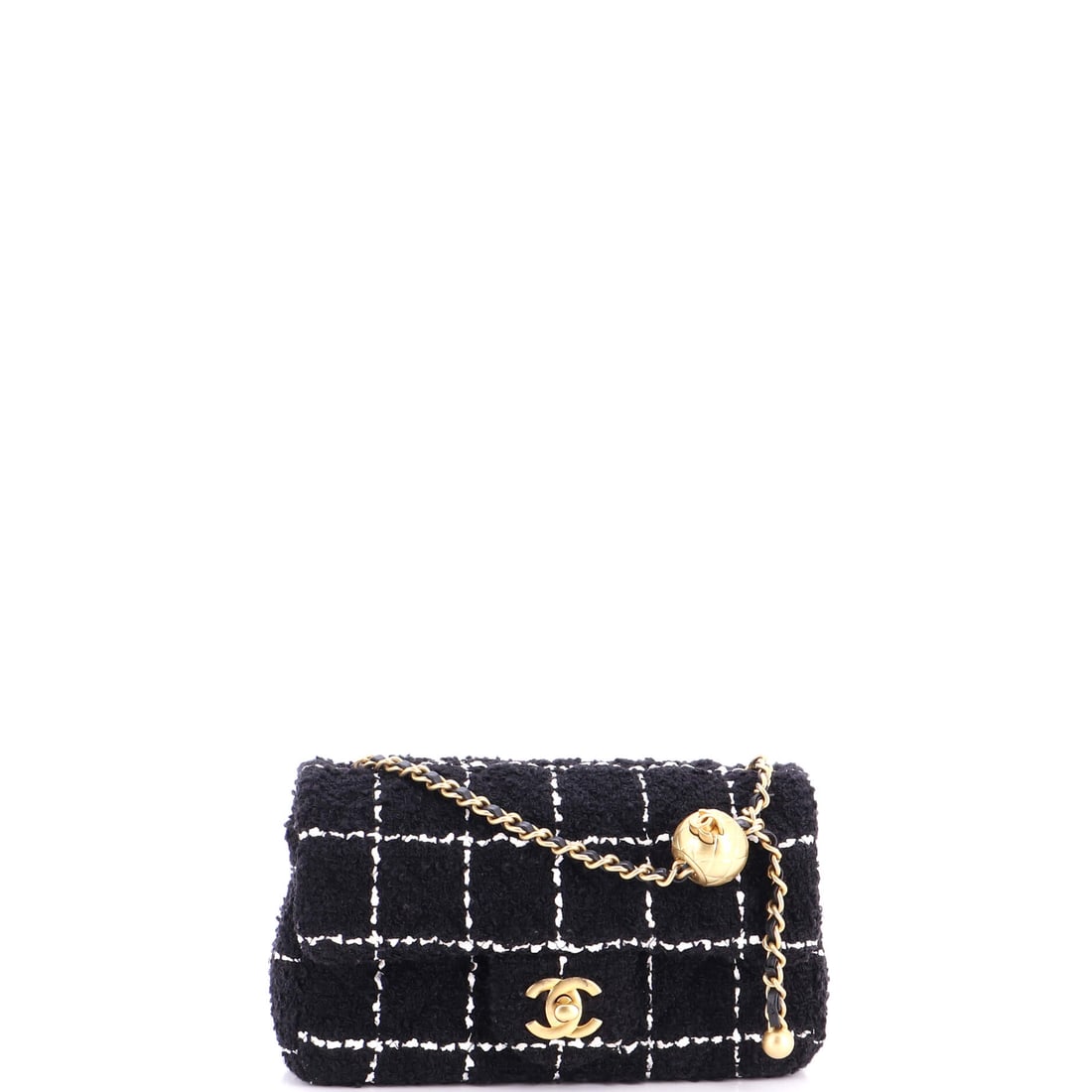 Chanel Pearl Crush Flap Bag Quilted Tweed: The tweed version of the Crush flap trades gloss for surface interest, with the weave visible through the quilt channels. It runs eight by five by 2.5 inches, small enough that the pearl hardware stay