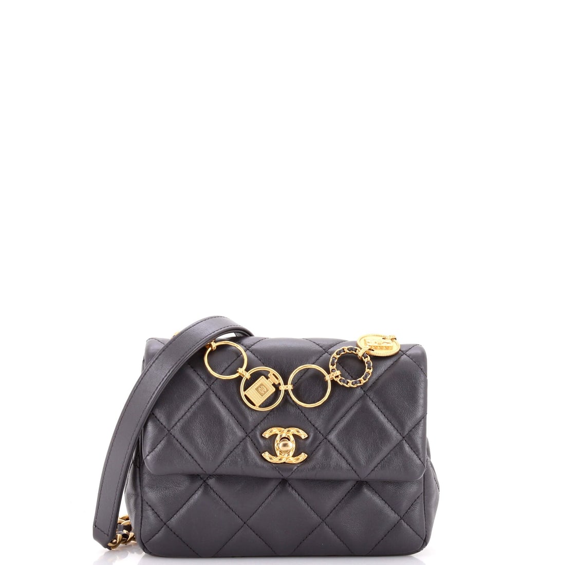 Chanel CC Charm Chain Strap Flap Shoulder Bag Quilted Lambskin: A CC charm swinging from the chain strap is the detail that names this small quilted lambskin flap. W 7 x H 5 x D 2 in is compact dinner scale, deep enough for essentials without adding bulk. Lambskin