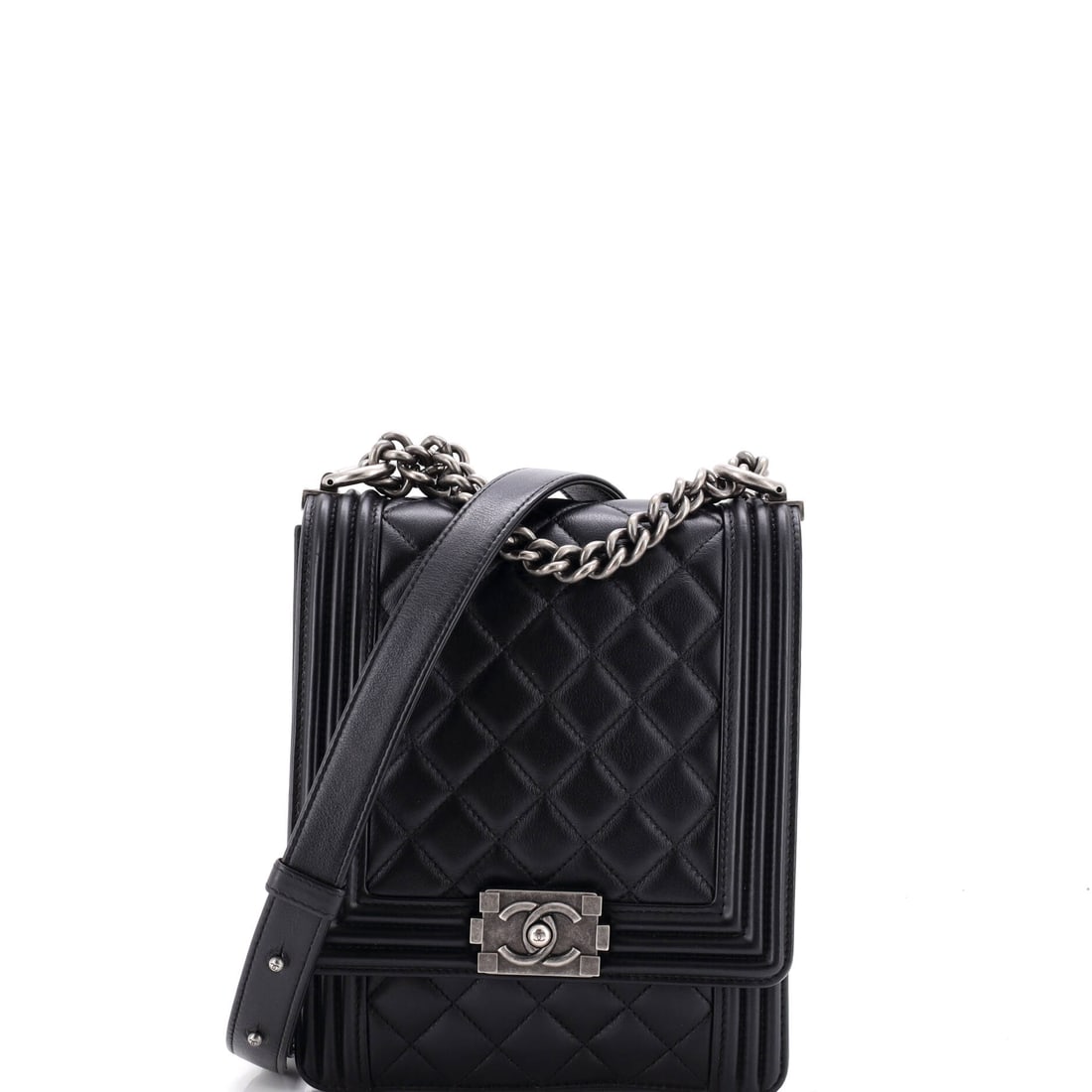 Chanel North South Boy Flap Bag Quilted Lambskin: Lambskin softens the Boy's usually rigid outline, and in the north-south format, 6 inches wide by 7.5 high and 2 deep, it sits close and quiet against the body. That vertical face gives the diamond qu