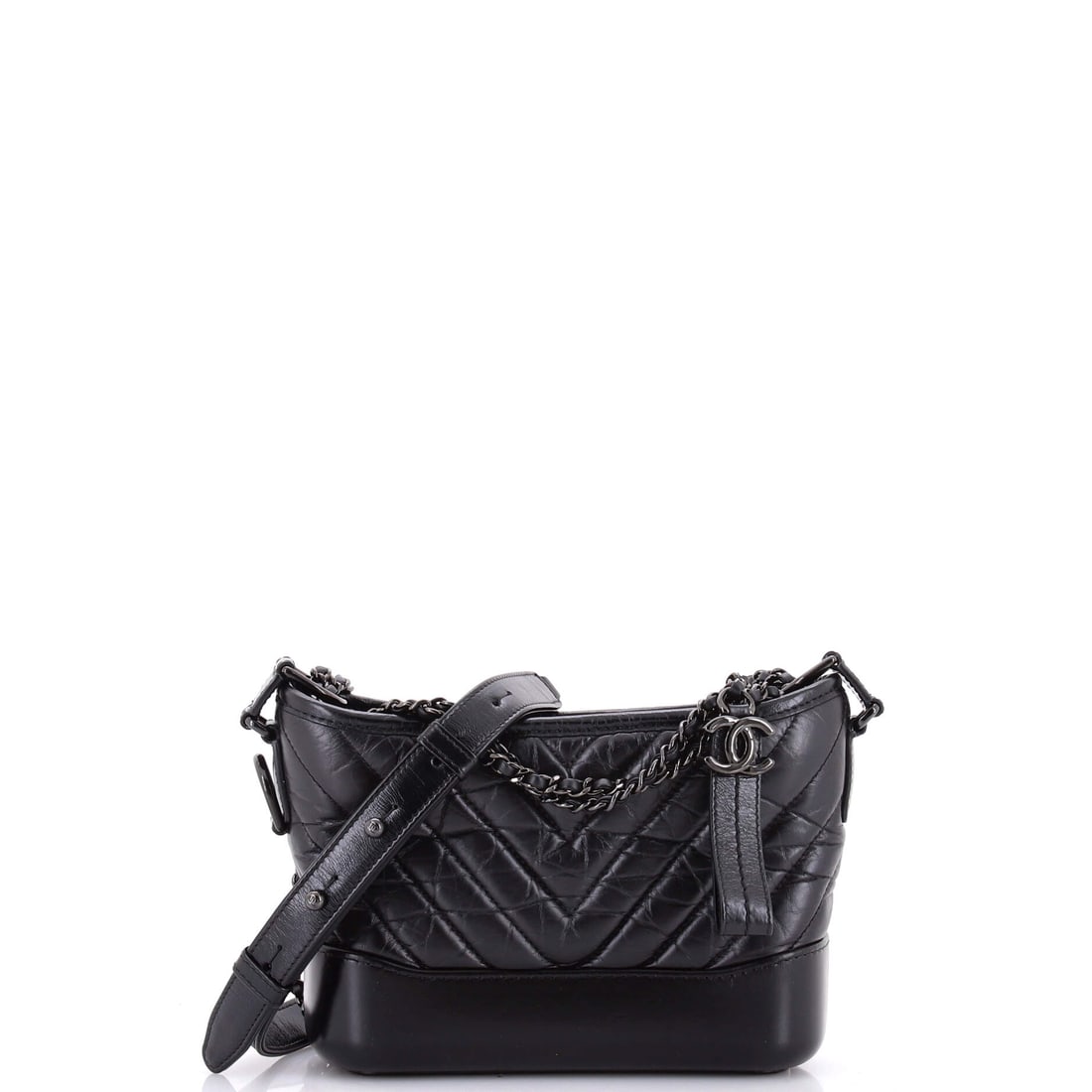 Chanel So Black Gabrielle Hobo Chevron Aged Calfskin: The Gabrielle hobo's flared base and drawn-in top give it a shape unlike anything else in the Chanel line, and chevron aged calfskin sharpens those panels. Small at 7.5 x 6 x 3 in, it is the size that