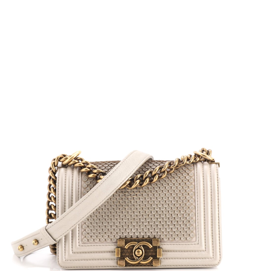 Chanel Boy Flap Bag Scaled Lambskin: Scaled lambskin gives this small Boy a reptilian surface while keeping the model's rigid, squared body. At W 8 x H 5 x D 3 in it is the compact cut, though 3 inches of depth stop it from being merely 