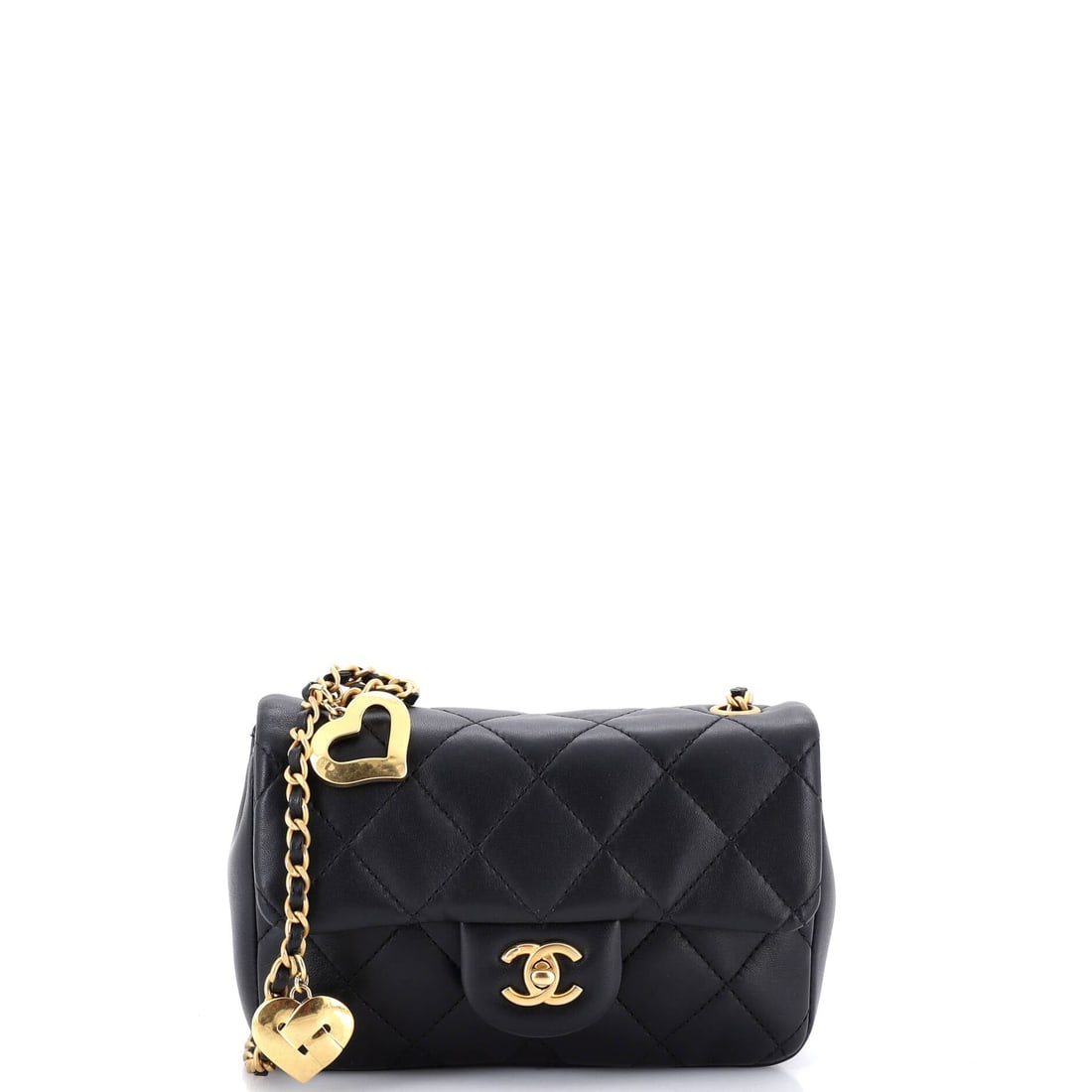 Chanel Heart Charms Flap Bag Quilted Lambskin: Lambskin quilting and a cluster of heart charms make this one of the more playful flaps Chanel has put on a chain. The charms move as you walk, which is the whole idea. Grade B - Excellent, and the ch