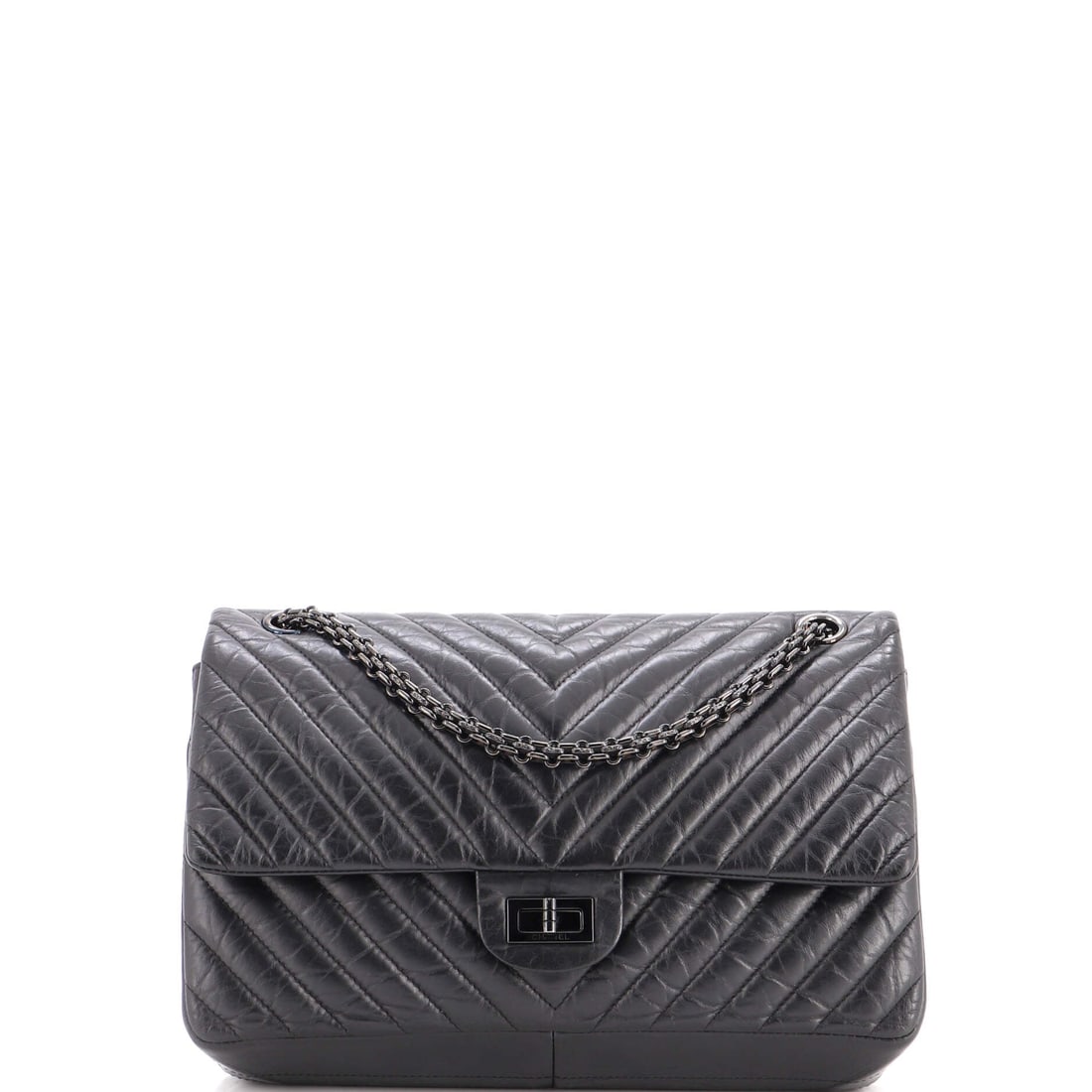 Chanel So Black Reissue 2.55 Flap Bag Chevron Aged Calfskin: The woven chain on this So Black Reissue sits in the same dark tone as the chevron leather, so nothing interrupts the surface. At 11 x 7 x 3 in it is the mid-large size, worn at 19.5 in single or 11 i