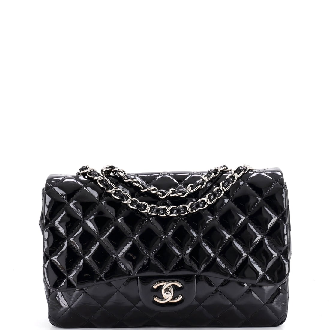 Chanel Vintage Classic Single Flap Bag Quilted Patent: Patent leather holds the quilting in high relief, and on an 11.5 x 8.5 x 4 in single flap the effect is deliberately loud. Four inches of depth mean the interior takes a full day without gaping. The c