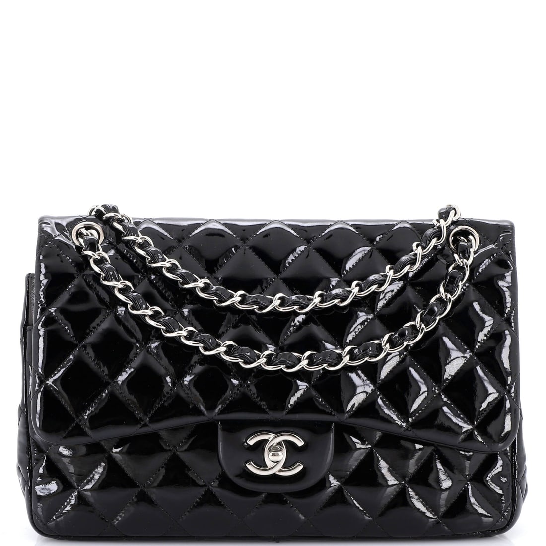 Chanel Classic Double Flap Bag Quilted Patent: Two flaps, not one: the outer with its turnlock, the inner one Chanel built in for security, plus the rear slip pocket. Patent holds a mirror surface across the quilting and wipes down easily, useful 