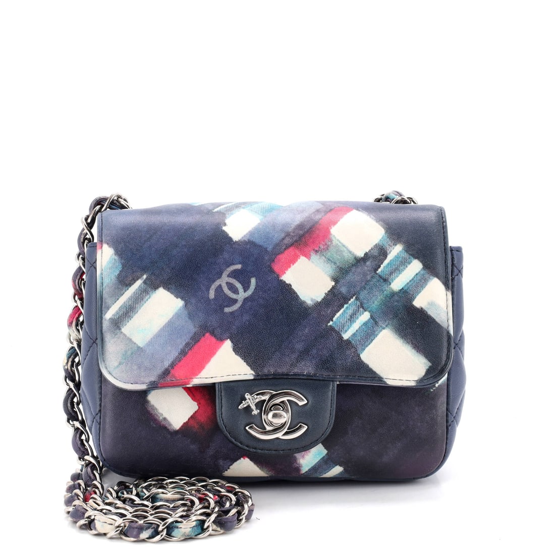 Chanel Airlines CC Flap Bag Printed Leather: Printed leather carries the Airlines CC graphics across a small flap bag built at 6.5 inches wide, 5 high and 3 deep. A 21 inch strap drop makes it crossbody-capable, which is how a bag this size is b