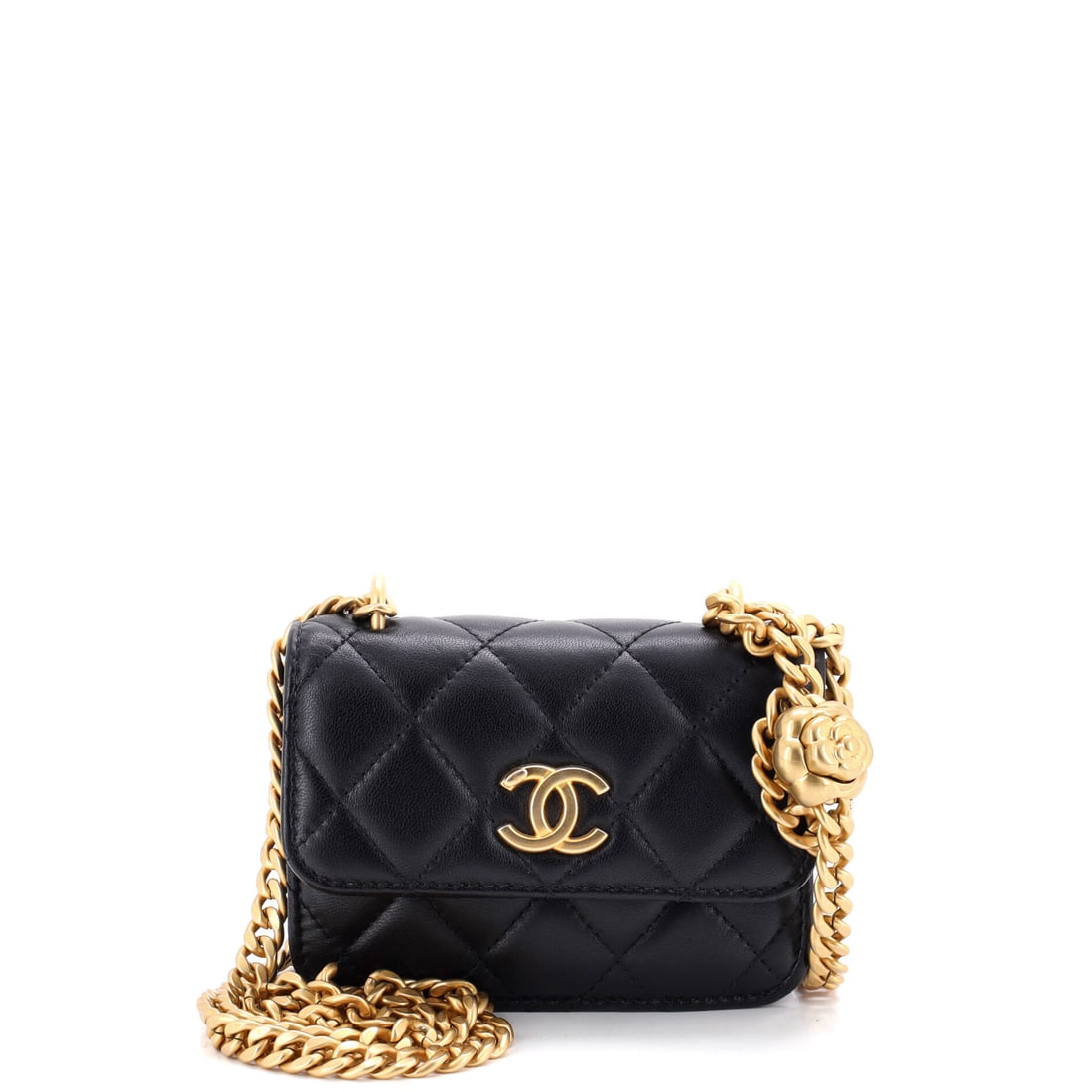 Chanel Sweet Camellia Flap Clutch with Chain Quilted Lambskin: The flap-and-chain format keeps this camellia clutch hands-free, which is the whole argument for it over a plain evening pouch. Grade B - Excellent, with the quilting well kept. Its 5 inch width and 3
