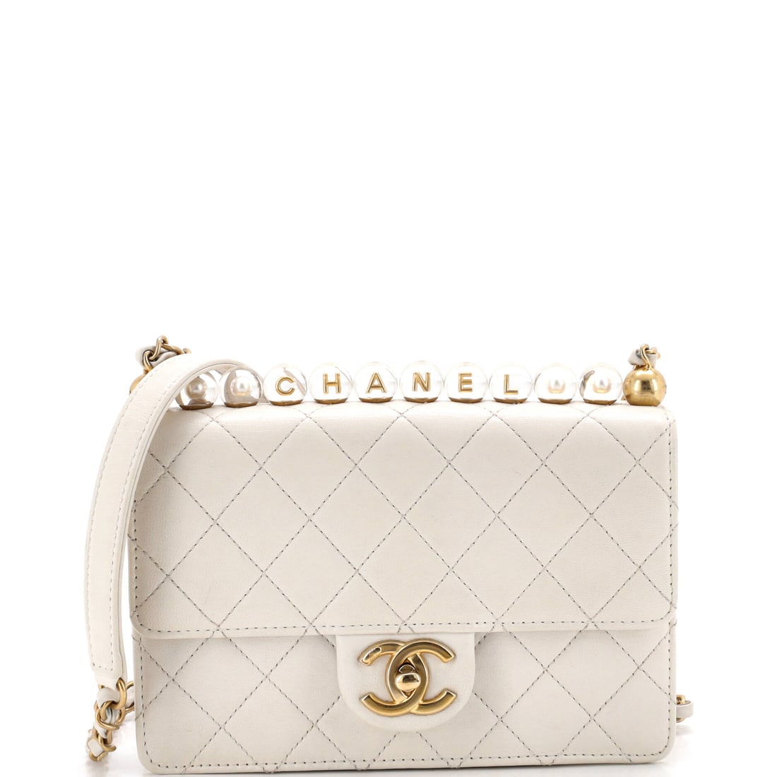 Chanel Chic Pearls Flap Bag Quilted Goatskin with Acrylic Beads: Pearls draw the eye first, but the flap underneath is a proper quilted goatskin bag with a 2 inch gusset behind a 7.5 by 6 inch face. Worn at the full 22 inch drop it hangs at the hip, where the beads