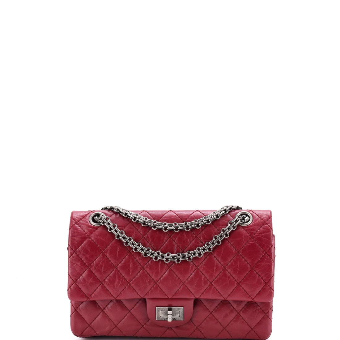 Chanel Reissue 2.55 Flap Bag Quilted Aged Calfskin: Mid-size 2.55s in aged calfskin are the workhorses of the line, and this 6 in tall example takes a phone, cardholder and compact with room to spare. Grade C - Very Good, with the 20 in chain giving a 