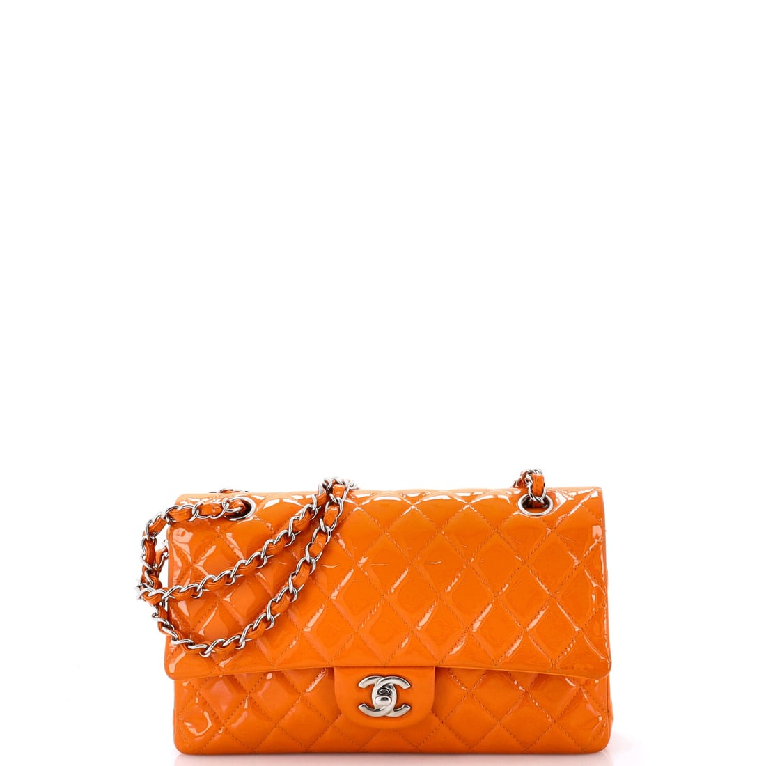 Chanel Classic Double Flap Bag Quilted Patent: Medium-scale patent flaps like this one, 10 in across by 6 in high and 3 in deep, cross from daytime into evening without changing character. The gloss finish is what makes that work, catching light t