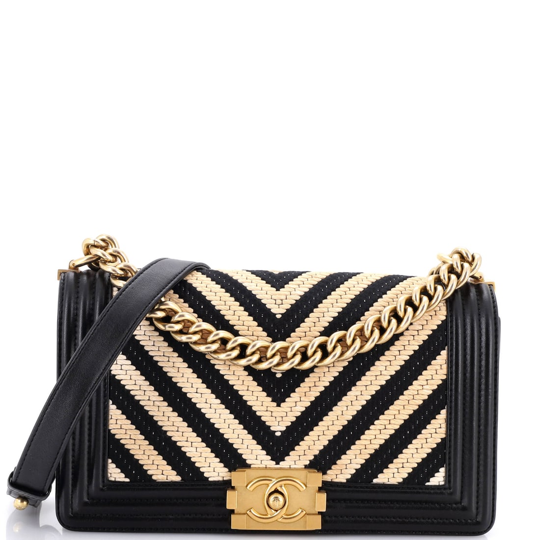 Chanel Boy Flap Bag Braided Chevron Calfskin and Lambskin: Braided trim edges the chevron panels on this Boy, mixing calfskin and lambskin so the surface changes texture as it moves. Ten inches wide and 6 high, running 3 deep, it belongs among the larger Boy 