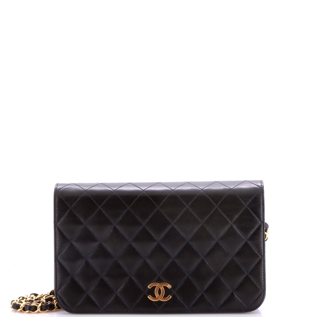 Chanel Vintage Full Flap Bag Quilted Lambskin: Full flap construction means the front closes edge to edge, and on a 9.5 x 5.5 x 3 in body that gives a clean, uninterrupted quilt face. The chain runs 20 in. Grade C - Very Good, with use to match. I