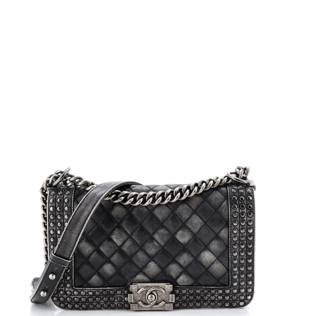 Chanel Paris-Dallas Boy Flap Bag Studded Quilted Distressed Calfskin: Studs punctuate the distressed calfskin here, and the Boy's rectangular frame keeps all that surface texture disciplined. Narrower than most of the line at eight inches across by six high, it reads co