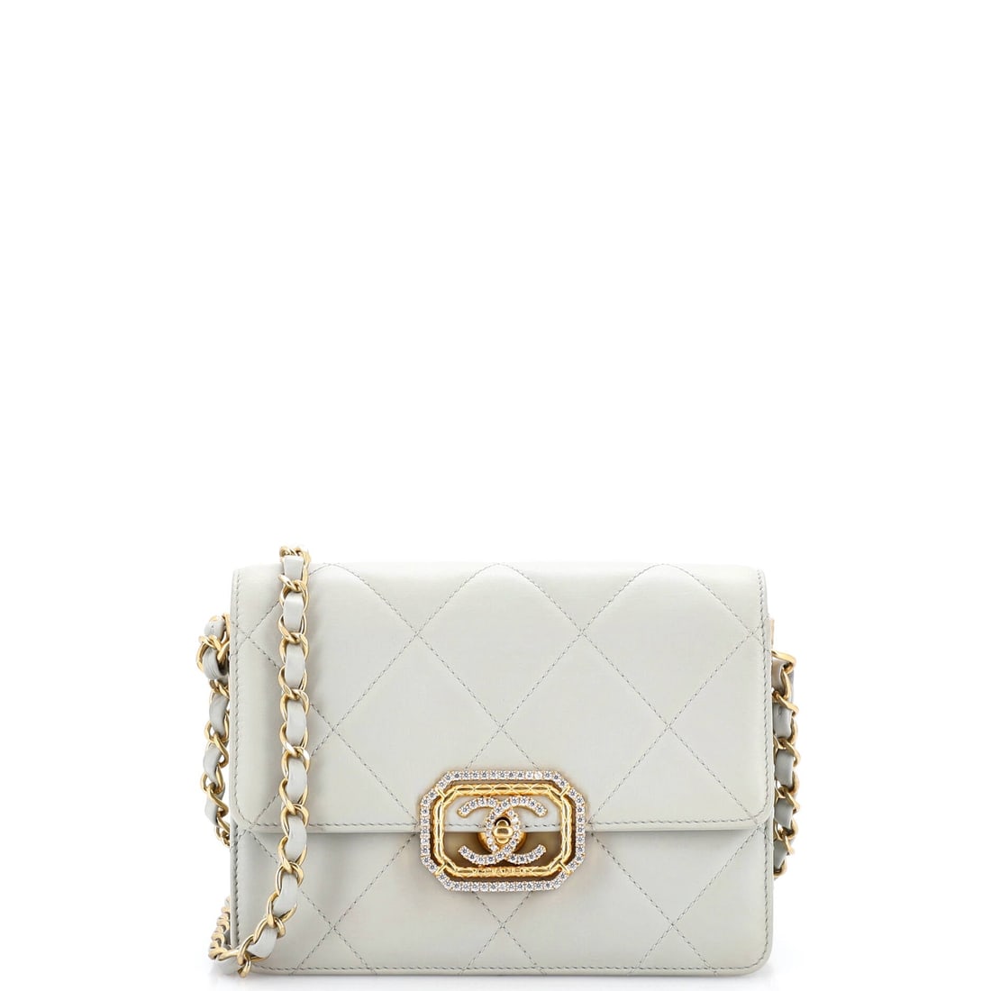 Chanel Crystal Geometric Frame CC Flap Bag Quilted Calfskin: A crystal geometric frame around the CC gives this calfskin flap an architectural closure, more structured than the plain interlocking logo. Quilted calfskin holds shape better than lambskin, which he