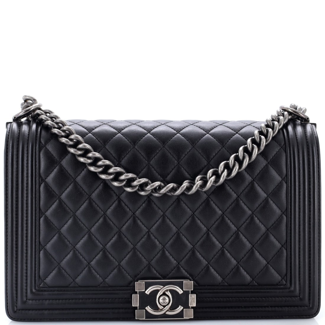 Chanel Boy Flap Bag Quilted Calfskin: Quilted calfskin sits between lambskin's give and caviar's grain, holding a crisp diamond without scuffing at the first knock. This is one of the large bodies at 11 by 8 by 3 inches, tall enough to ta