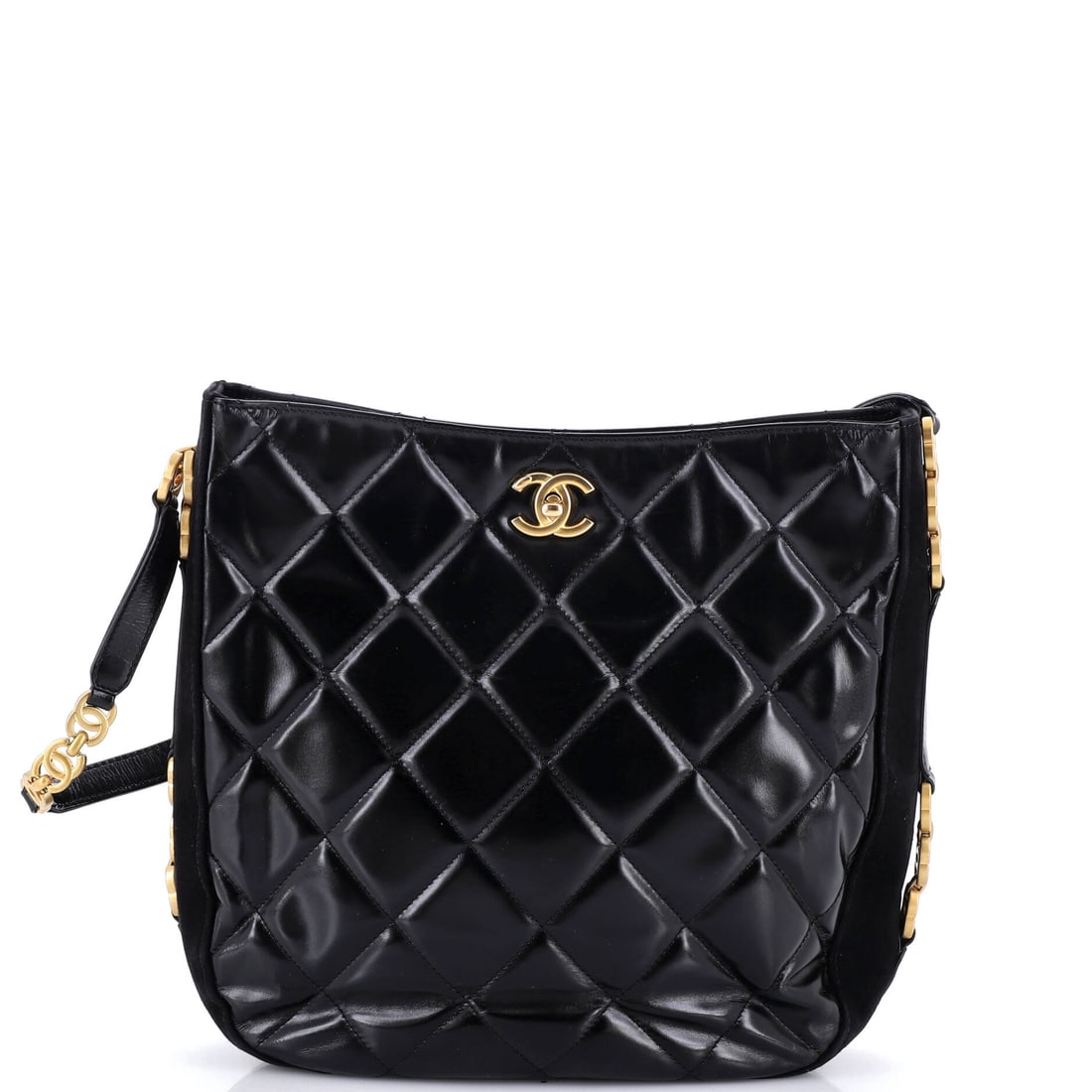 Chanel Tiny CC Link Hobo Quilted Shiny Calfskin and Suede: Shiny calfskin against suede gives this hobo two surfaces to play off, with the tiny CC link chain kept deliberately fine. Squared up at 11 by 11 inches and 3 deep, it is the largest bag in this group