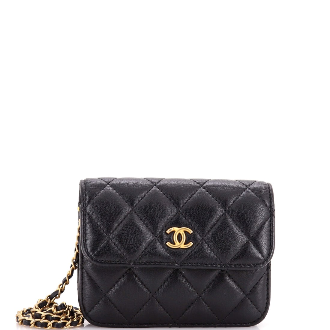 Chanel Pearl Crush Flap Clutch with Chain Quilted Lambskin: Held flat against the body, a 4.5 inch quilted lambskin clutch reads closer to jewelry than luggage, and the pearl-set chain leans the same way. One inch of depth rules out anything past a phone, card