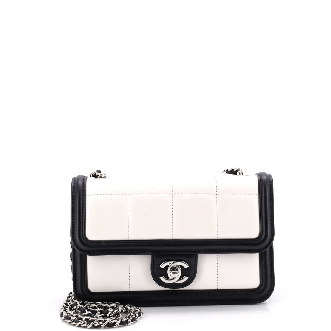 Chanel CC Chocolate Bar Flap Bag Quilted Lambskin: Chocolate bar quilting, wide horizontal panels instead of fine diamonds, gives this flap a graphic front readable across a room. W 8 x H 5 x D 2.5 in keeps it small, and the 17 in strap drop puts it h