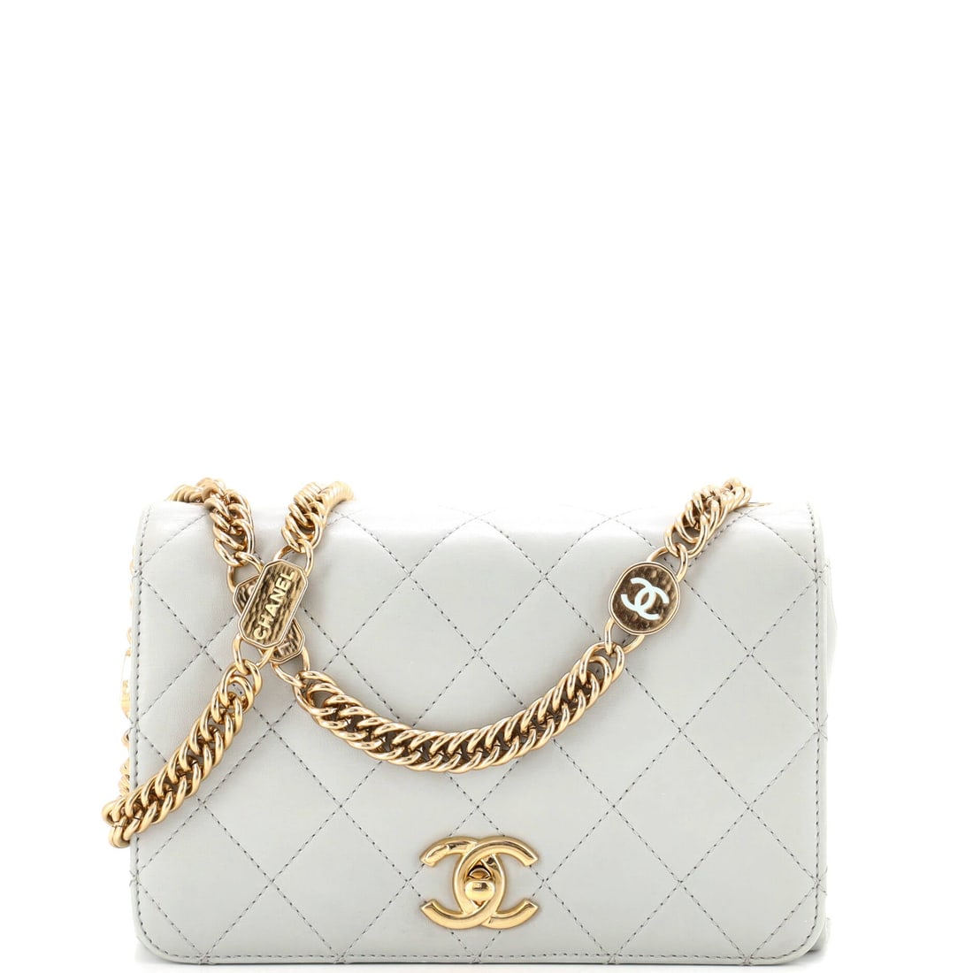 Chanel Logo Enamel Full Flap Bag Quilted Lambskin: A full flap in quilted lambskin with enamel logo hardware, 8 by 5 inches and 3 deep. Strap drops of 16 and 4 inches give shoulder or hand carry as the day requires. Grade C - Very Good is the honest n