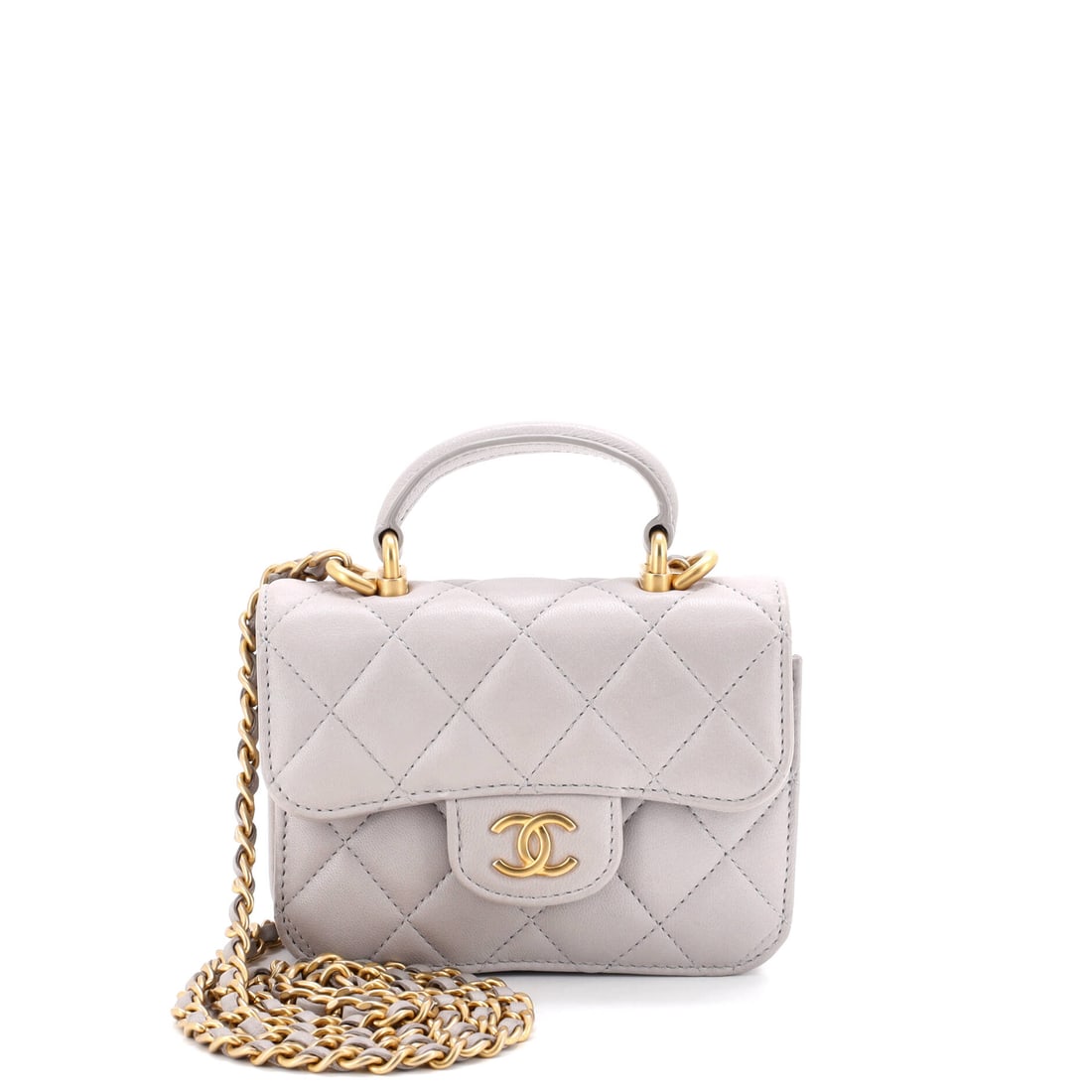 Chanel Top Handle Flap Coin Purse with Chain Quilted Lambskin: Slightly trimmer at 4.5 inches wide, this coin purse keeps the same 3.5 in height and 1.5 in depth, so the change is in footprint rather than capacity. Its 21.5 in chain sets it crossbody, and the 1.5