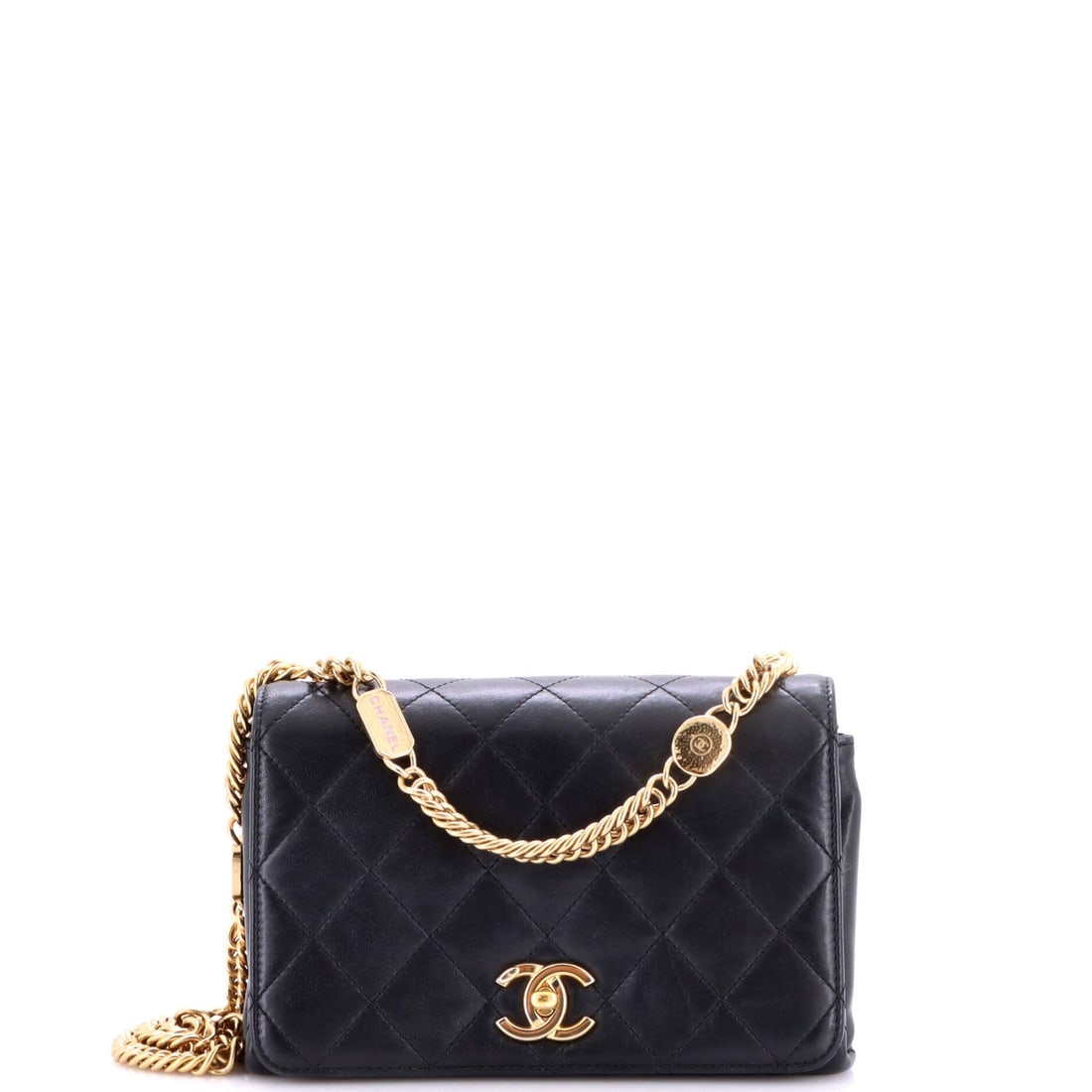 Chanel Logo Enamel Full Flap Bag Quilted Lambskin: Quilted lambskin, enamel logo hardware and a full flap front: the appeal is in how the glossy closure plays against a matte quilt. Measurements run 8 by 5 by 3 inches, with a 16 inch strap for the
