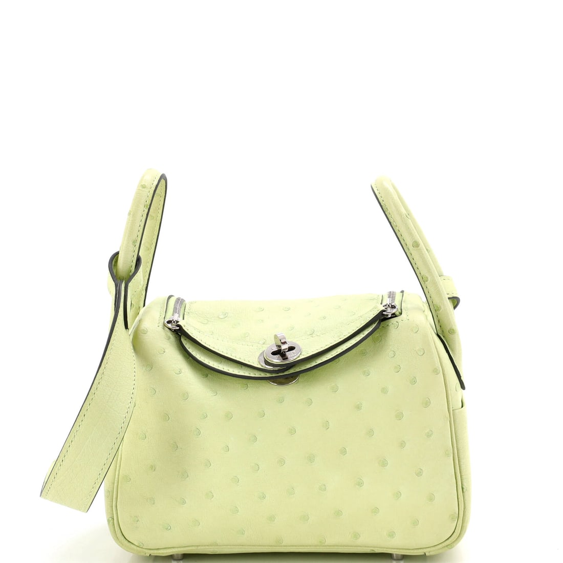 Hermes Lindy Bag Verso Ostrich: Ostrich on a Lindy is a serious specification - the quill pattern gives the soft body a texture no calfskin can imitate, and the Verso lining adds contrast inside. At 7 in wide, 5 in high and 3.5 in d