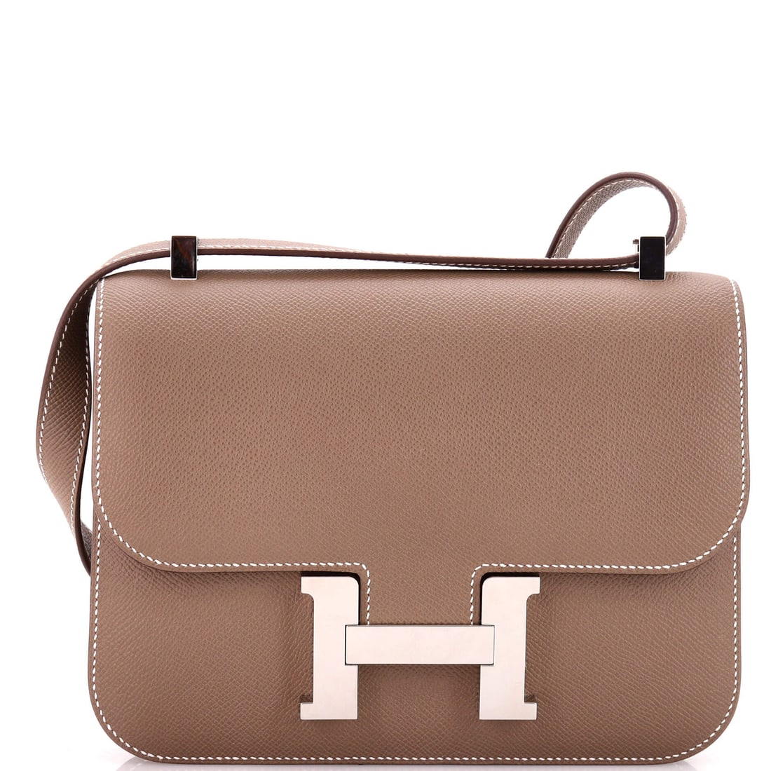 Hermes Constance NM Bag Epsom: The larger Constance NM at 9 in wide, 7 in high and 3 in deep gives the H clasp more surface to sit against and adds real capacity. Epsom keeps the flap flat. Grade B - Excellent. Maison de Beaubigonn