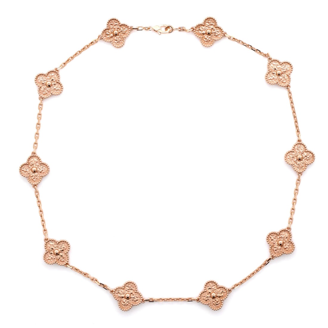 Van Cleef & Arpels Vintage Alhambra 10 Motifs Necklace 18K Rose Gold: At 18 in this Vintage Alhambra sits lower than the standard ten-motif length, which changes how the clover motifs fall against the neckline. Eighteen karat rose gold, with each motif measuring 14.75mm