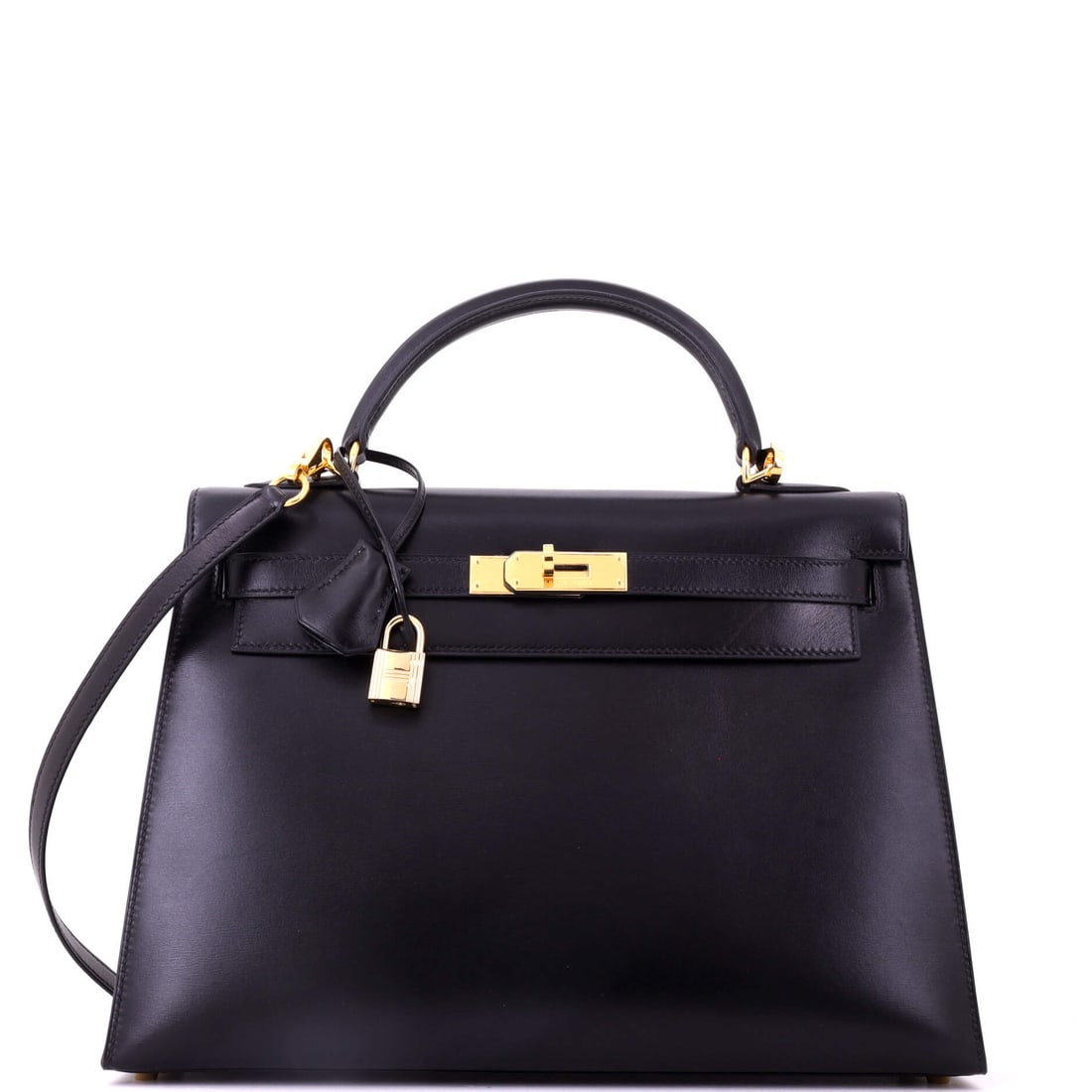 Hermes Kelly Handbag Black Box Calf with Gold Hardware: Box calf is the most demanding leather Hermes works in, and on a 13 in Kelly the glossy black panels are shown at their largest. Gold hardware completes the traditional reading. Nine inches high, 4 de