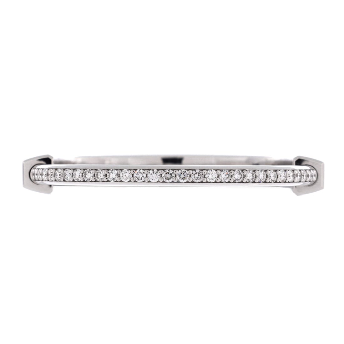 Tiffany & Co. Lock Bangle Bracelet 18K White Gold with Pave Diamonds: The Lock bangle is Tiffany's most recent hit, built around a padlock clasp that opens rather than a hinge. In 18K white gold with pave diamonds it reads cooler and more modern than the yellow gold