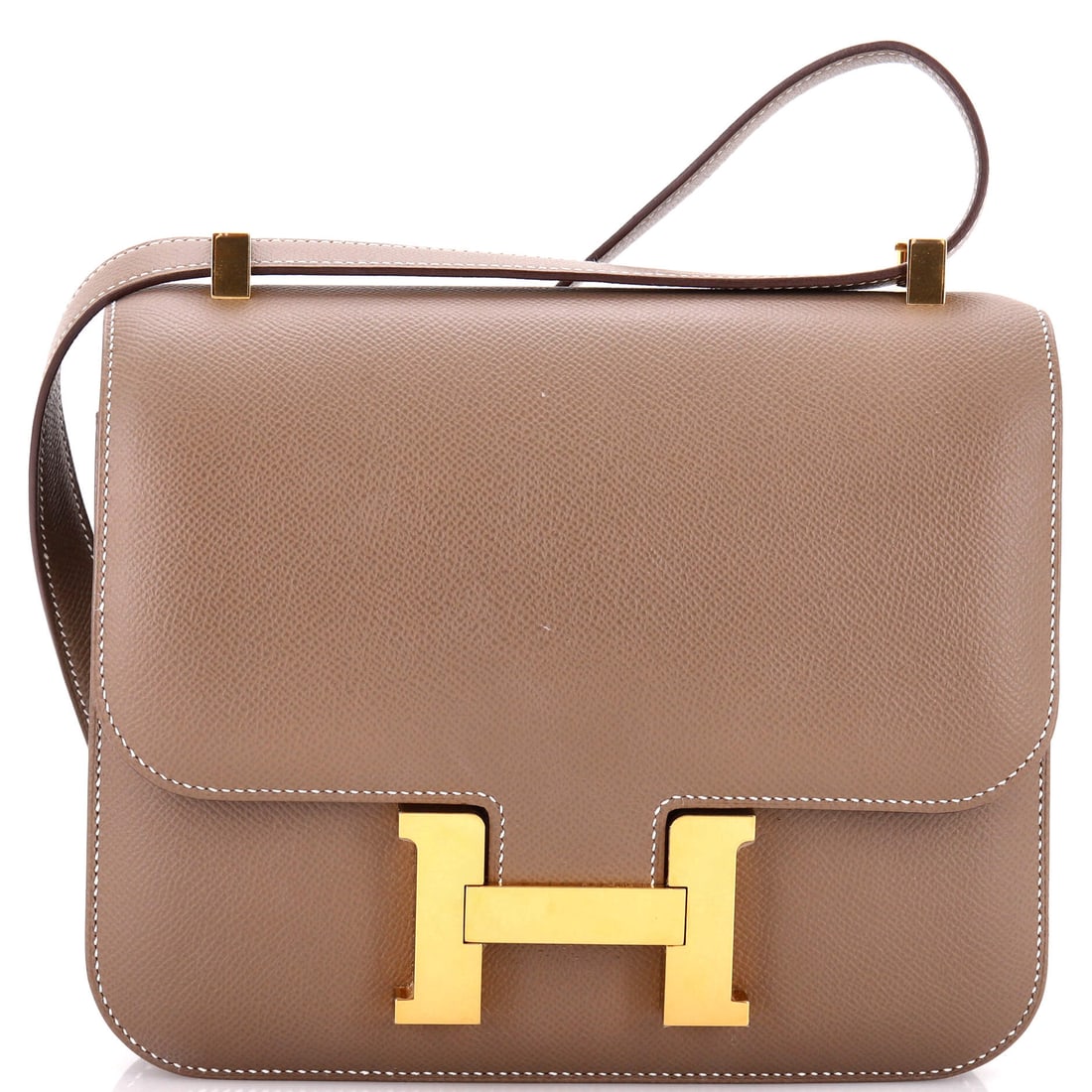 Hermes Constance Bag Epsom: The larger Constance body at 9 in wide, 7 in high and 3 in deep, in Epsom. Enough room to work as a daily bag while keeping the flat front the model is built around. Grade C - Very Good. Maison de Bea