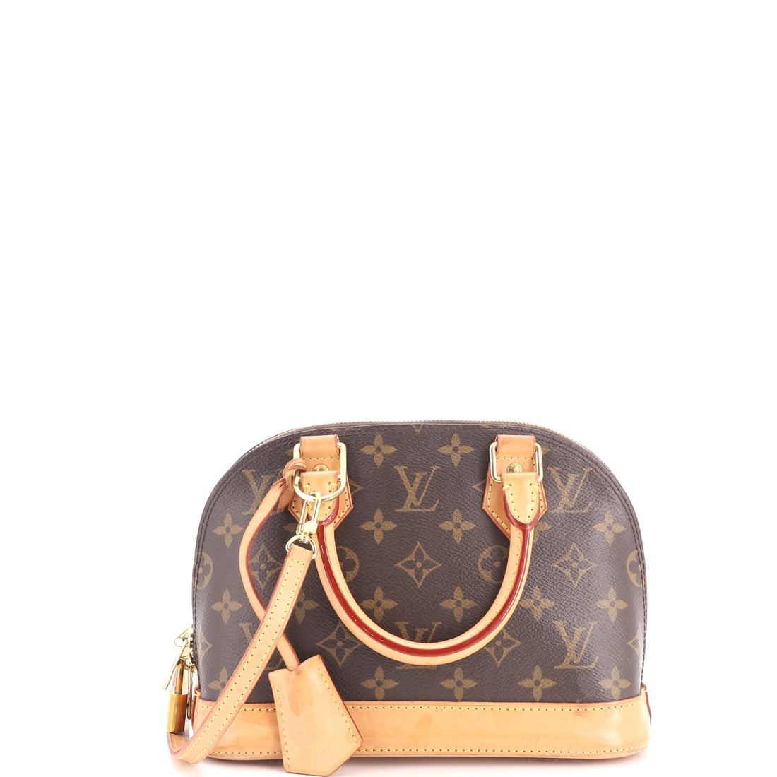 Louis Vuitton Alma Handbag Monogram Canvas: Nine inches across, the Alma BB is the size that turned an established handbag into a small, hard-edged accessory, the proportions reading as jewelry-adjacent while the construction stays exactly what