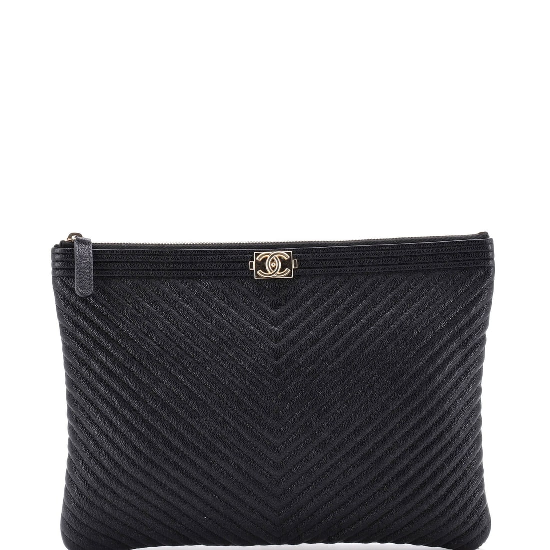 Chanel Boy O Case Clutch Chevron Caviar: Chevron quilting on caviar calfskin is a firmer combination than the diamond version: the grain resists scuffing and the V-lines keep their definition instead of softening with use. The O Case is the 
