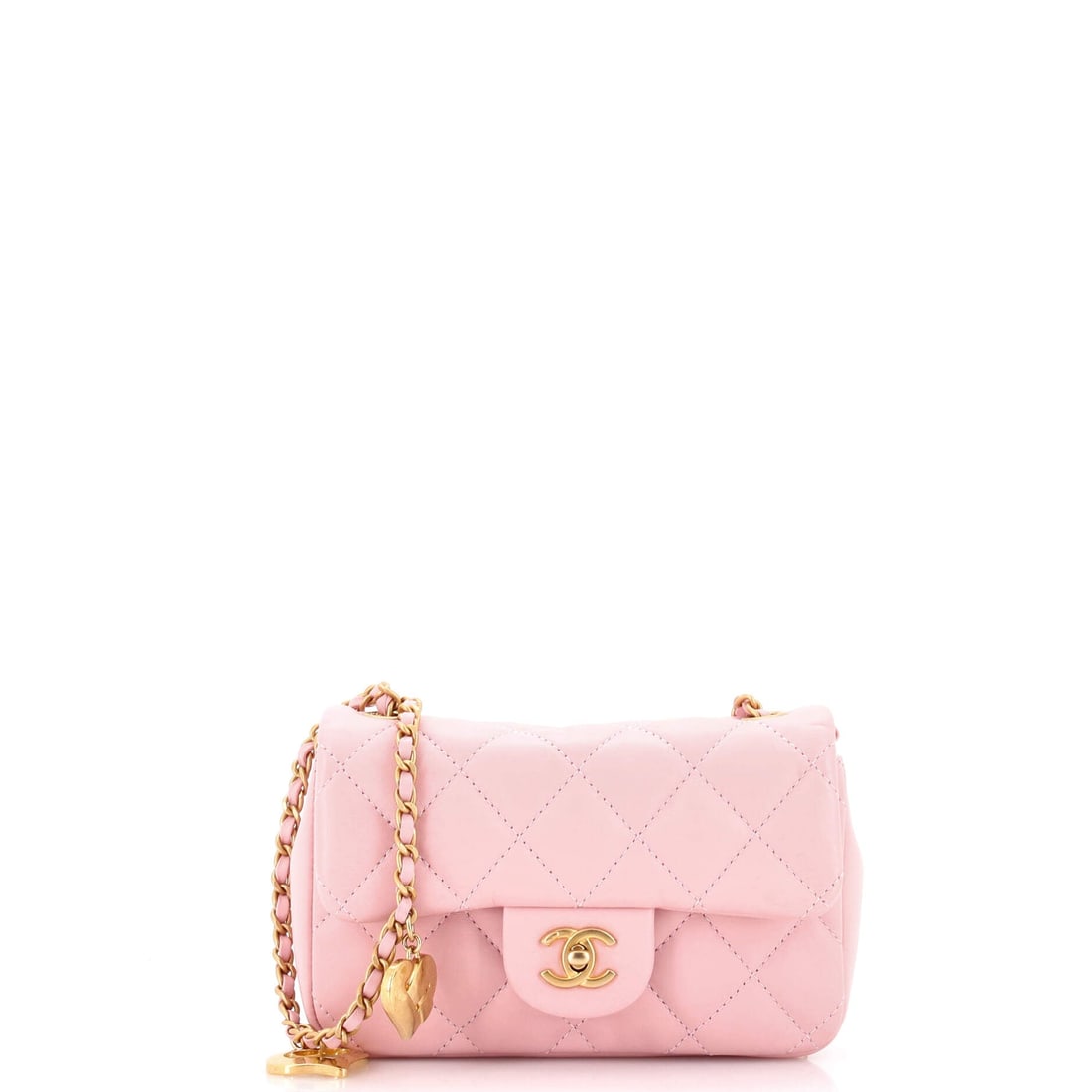 Chanel Heart Charms Flap Bag Quilted Lambskin: Heart charms hanging from the chain give this Mini flap a novelty the plain versions do not have, and Chanel's charm-led pieces have been drawing their own bidders. The body is small at 7 in wide, 4.5