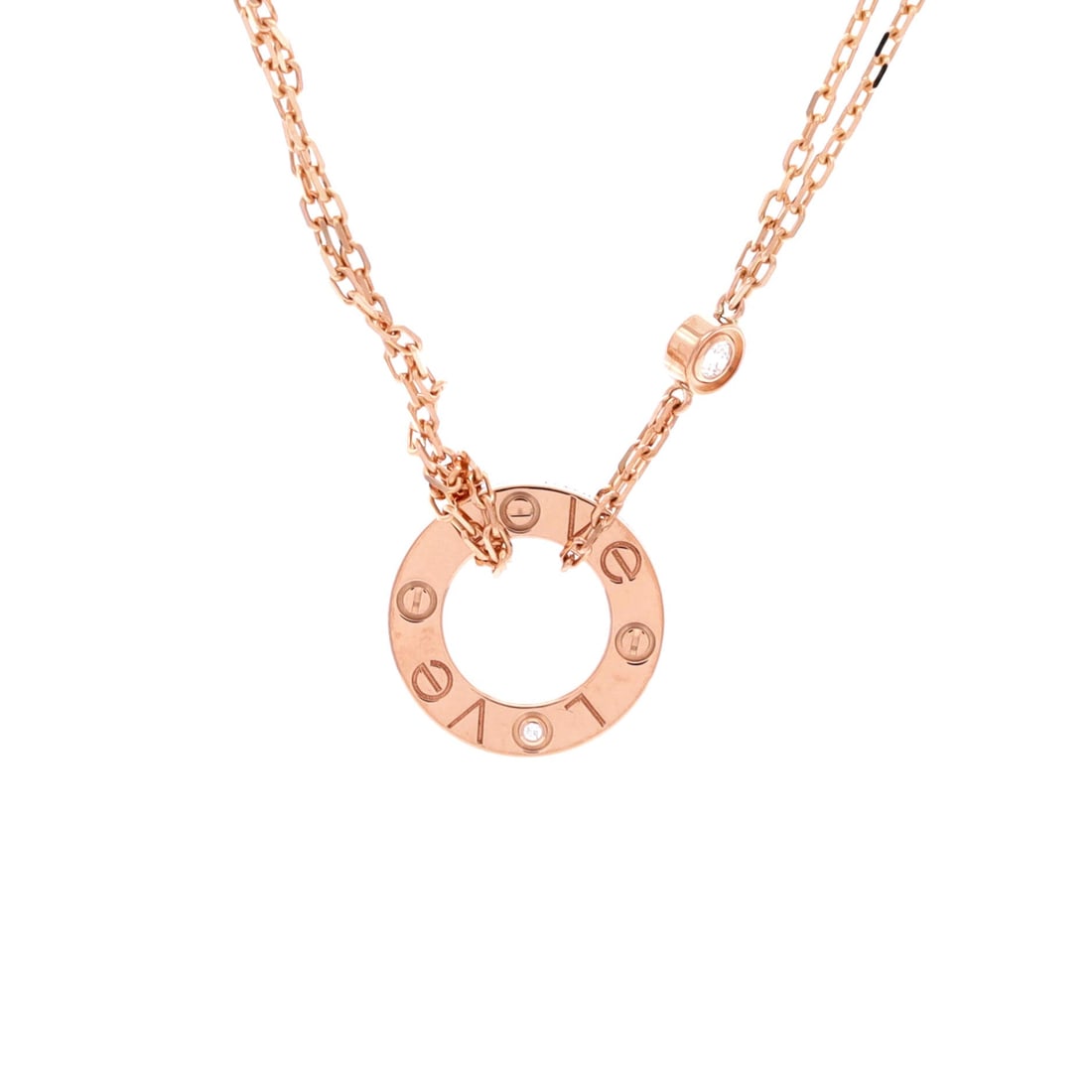 Cartier 2 Diamonds Love Pendant Necklace 18K Rose Gold and Diamonds: A pendant reading of one of the most recognized designs in modern jewelry, in 18K rose gold with two diamonds along the screw-motif bar. The draw for bidders is wearability: light enough for every day