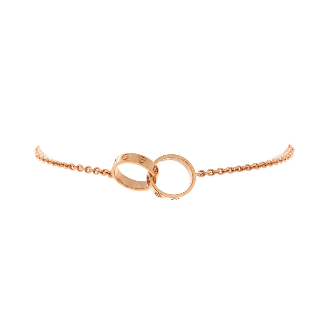 Cartier Love Interlocking Bracelet 18K Rose Gold: 18K rose gold is the draw on this Love interlocking bracelet, the paired screw-motif rings sitting flat and turning as the wrist moves. Bidders who find the fixed Love bangle too committal tend to com