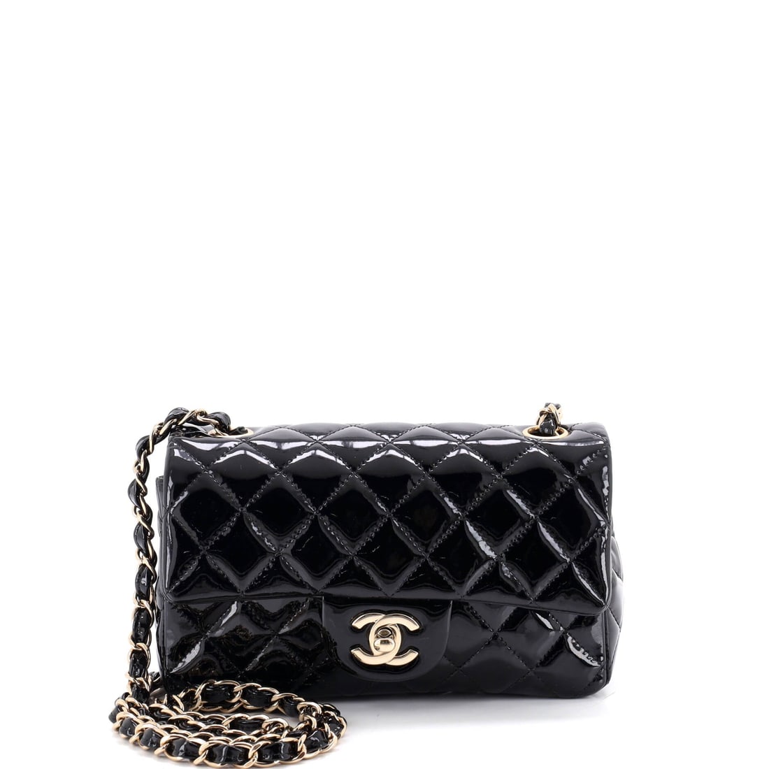 Chanel Classic Single Flap Bag Quilted Patent: Evening is the natural home for a patent Mini, and at 7.5 inches wide by 5 high with a 2 inch depth it holds a phone, cards and nothing that will spoil the line. The finish resists the fine scratching