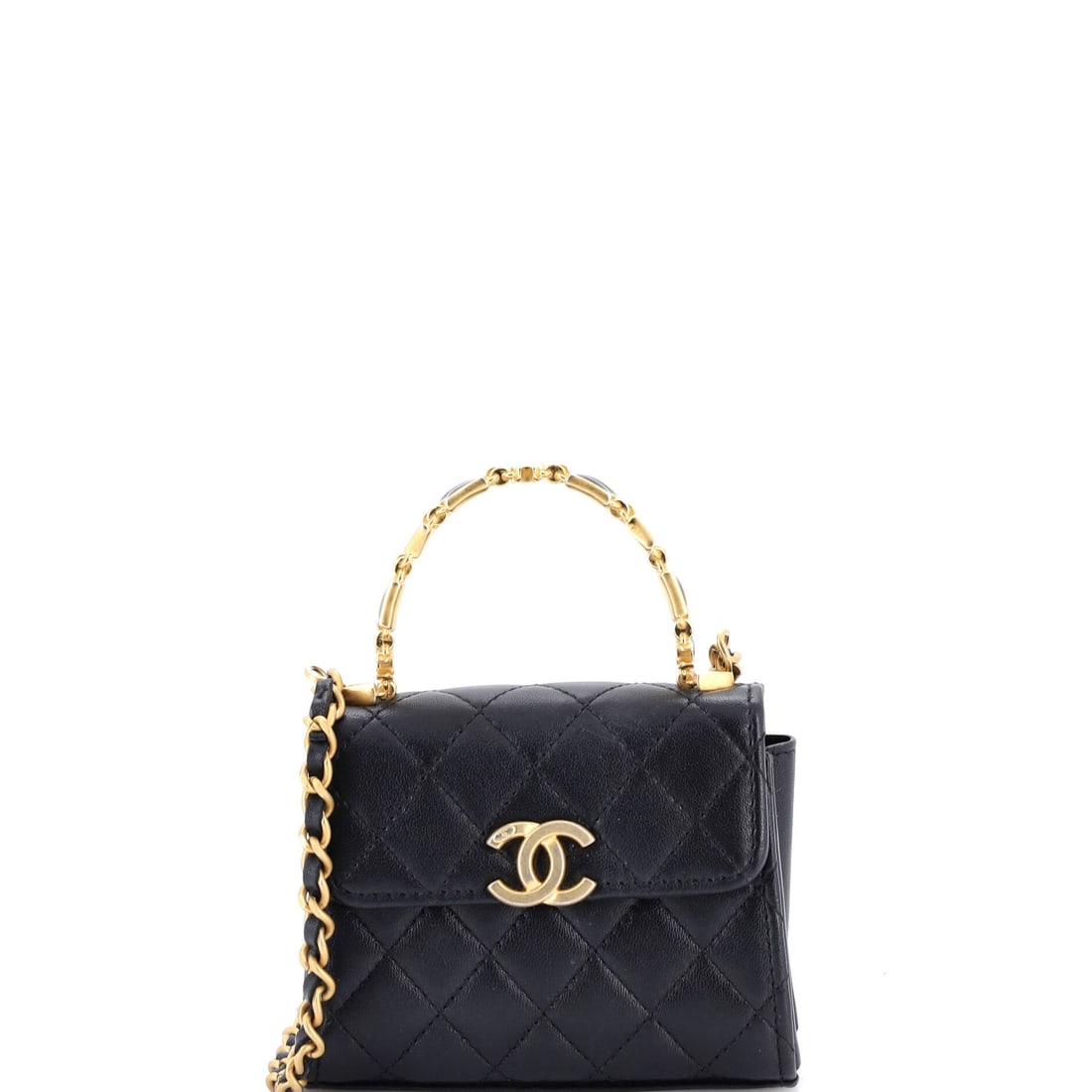 Chanel Coco Enamel Top Handle Flap Bag Quilted Lambskin: Small rather than Mini, this Coco Enamel handle flap runs 4.5 in wide by 5 in high with a 2 in depth, taller than it is wide, which is unusual for the shape. The enamel handle sits above quilted lambs
