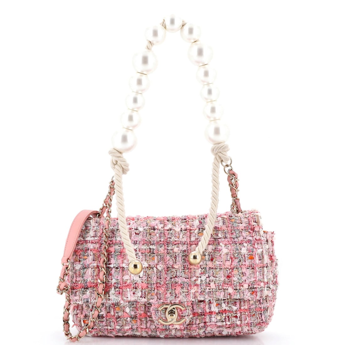 Chanel Pearl Handle Flap Bag Quilted Tweed: A pearl-set handle across the top of a tweed flap is a decorative move, and it places this with the seasonal pieces rather than the permanent line. Medium at 10 by 6 by 2.5 inches keeps it wearable in