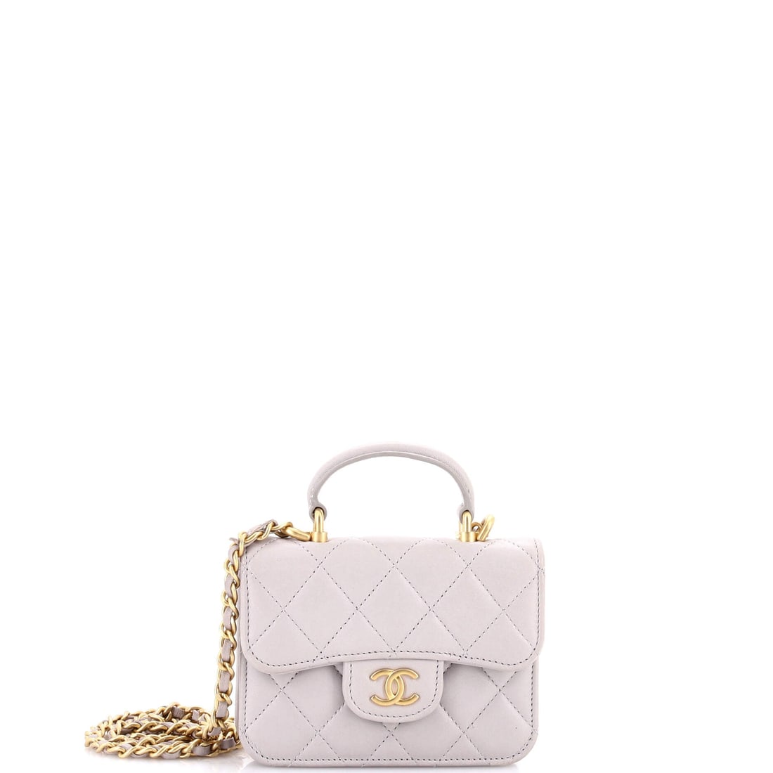 Chanel Top Handle Flap Coin Purse with Chain Quilted Lambskin: Handle up, chain down: the two-way carry is what separates this from every other small quilted pouch in the line. Lambskin over a 5 by 3.5 by 1.5 inch body keeps the weight negligible. The bag grades