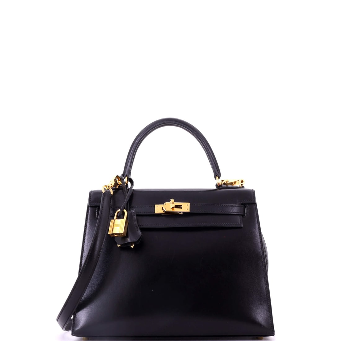 Hermes Kelly Handbag Black Tadelakt with Gold Hardware: Tadelakt is a smooth, lacquer-like leather that Hermes uses sparingly, and on a black Kelly with gold hardware it produces a near-mirror surface. That finish rewards close inspection and shows