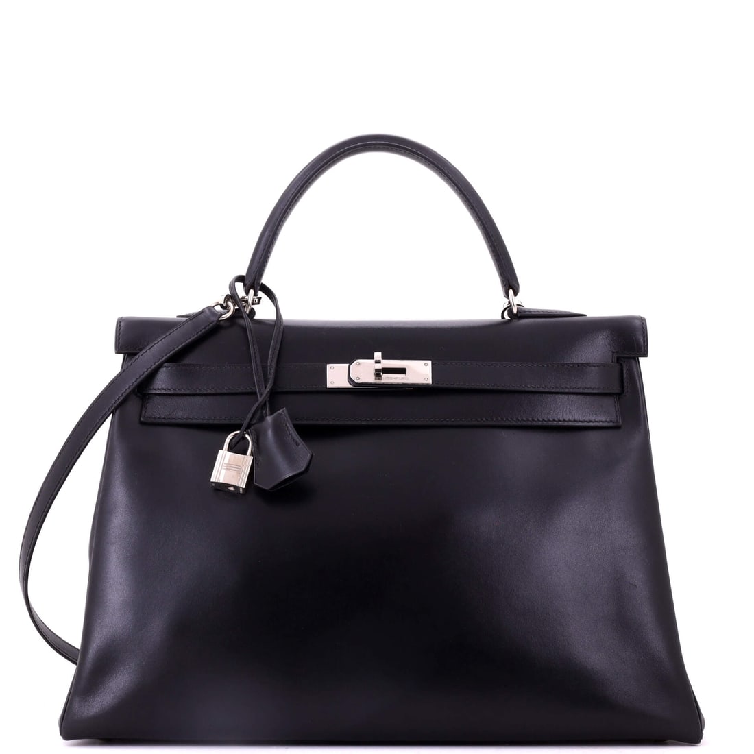 Hermes Kelly Handbag Black Box Calf with Palladium Hardware: Box Calf and palladium hardware make an unusually severe black Kelly, and at 13.5 in wide, 10 in high and 5 in deep it is a commanding version of the model. Box records its history in the surface, so 
