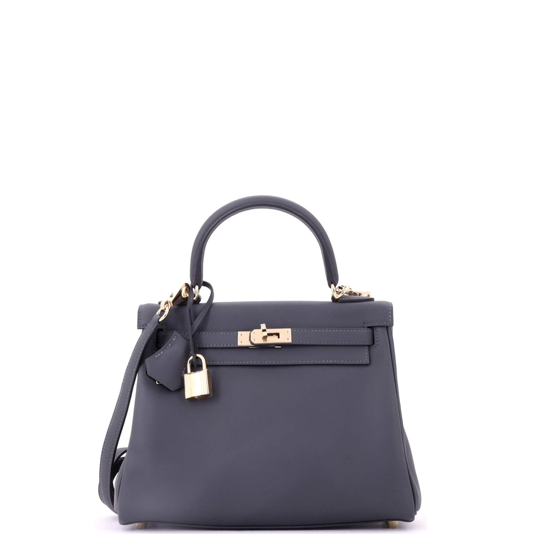 Hermes Kelly Handbag Verso Swift with Permabrass Hardware: Permabrass hardware and a Verso interior on a Swift Kelly make this an unusually specific bag, combining a scarce metal finish with a contrast lining. Measures 9.5 in wide, 8 in high and 4 in deep. Of