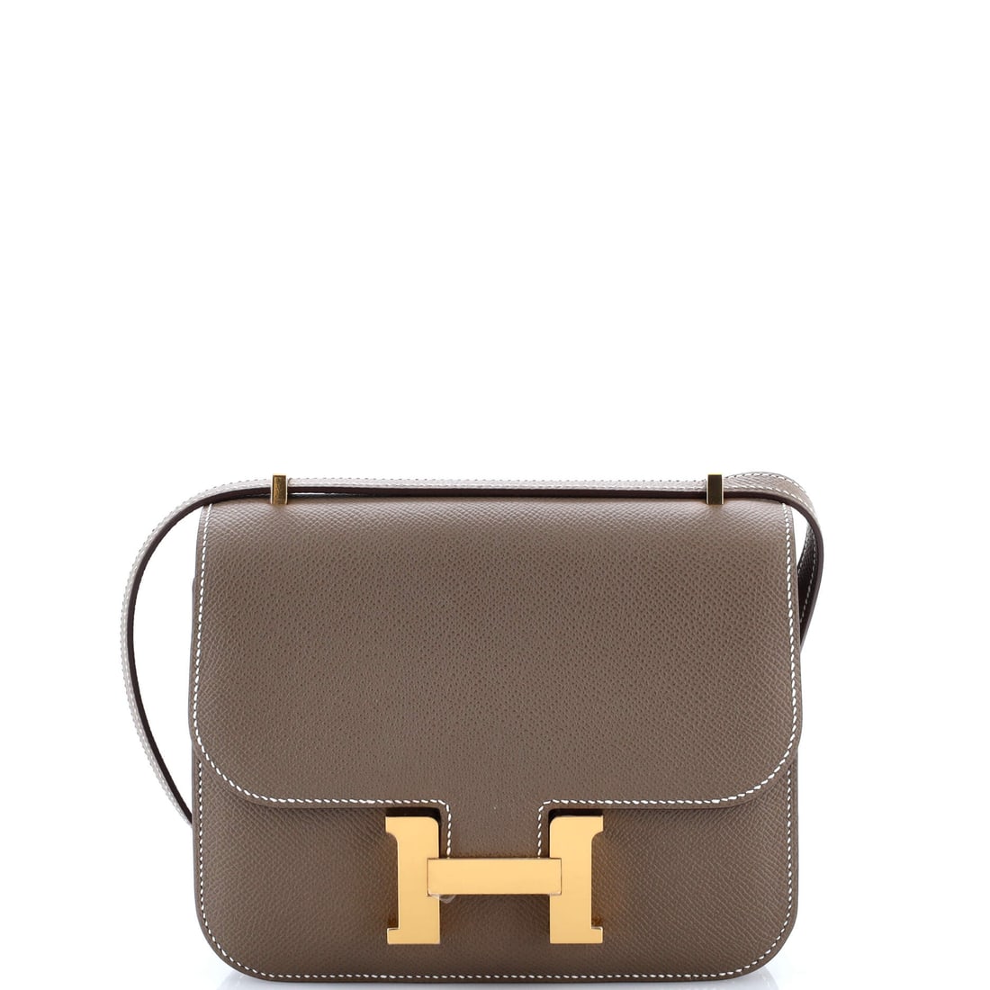 Hermes Constance NM Bag Epsom: Constance NM in Epsom, small at 7 in wide, 6 in high and 2 in deep. The clasp dominates the front entirely at this scale, and the strap converts between shoulder and crossbody. Grade A - Pristine. Mai