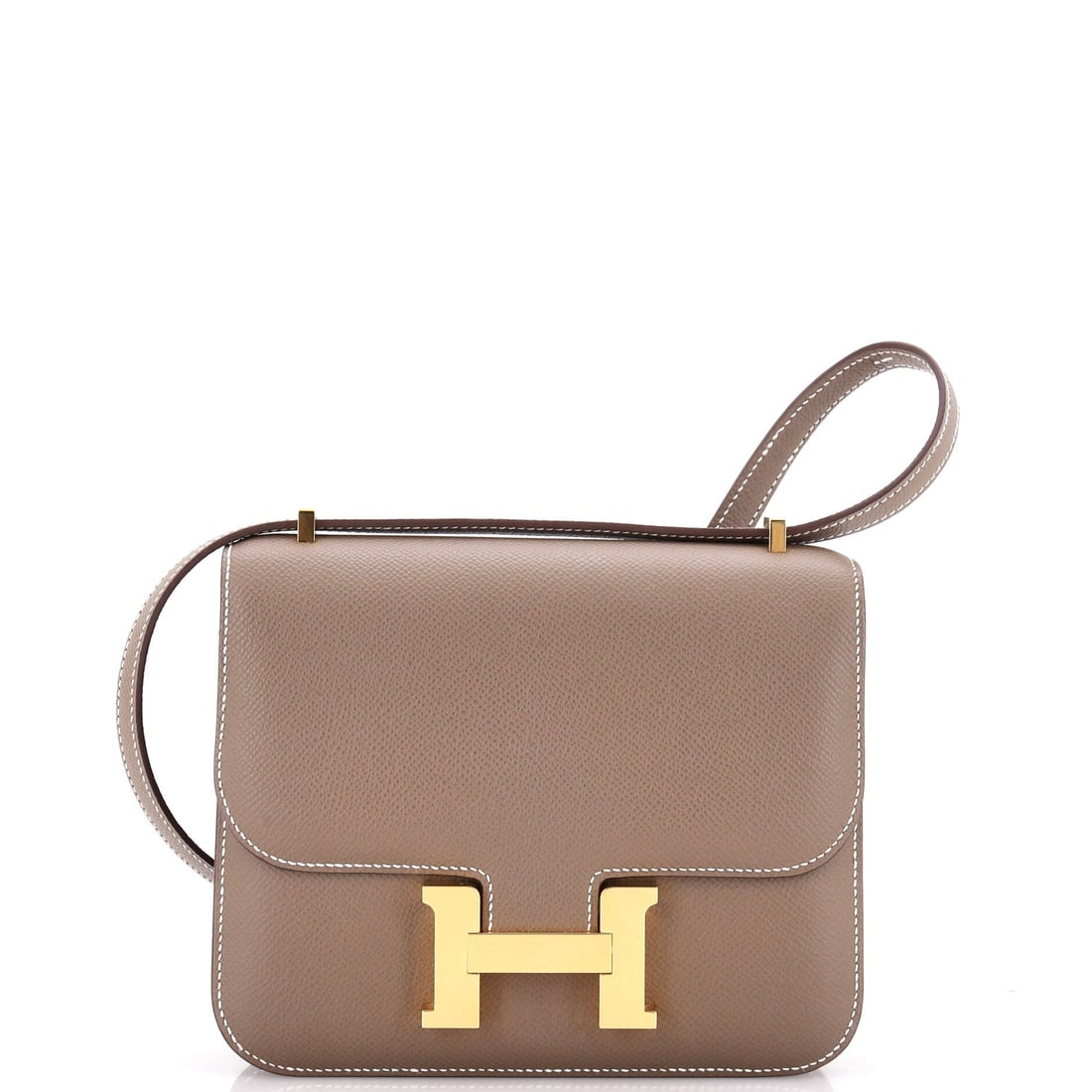 Hermes Constance NM Bag Epsom: Small, graphic and dominated by the clasp: a Constance NM in Epsom at 7 in wide, 6 in high and 2 in deep. The strap converts between shoulder and crossbody, which is what makes the smallest Constance 