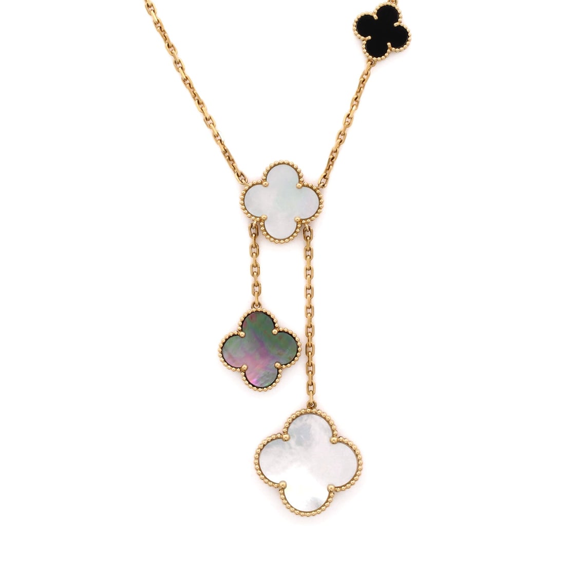Van Cleef & Arpels Magic Alhambra 6 Motifs Necklace 18K Yellow Gold and Mother of Pearl with Onyx: A Magic Alhambra six-motif necklace combining mother of pearl and onyx in 18K yellow gold. The alternating stones and varied motif sizes give it more movement than the single-material versions. Grade 