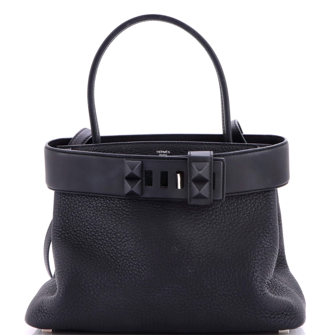 Hermes Medor Handbag Togo: The Medor's pyramid-studded clasp gives Hermes its most sculptural handbag, and Togo keeps the panels firm enough to carry it. Measures 10 in wide, 8.5 in high and 4.5 in deep. Grade B - Excellent. Ma