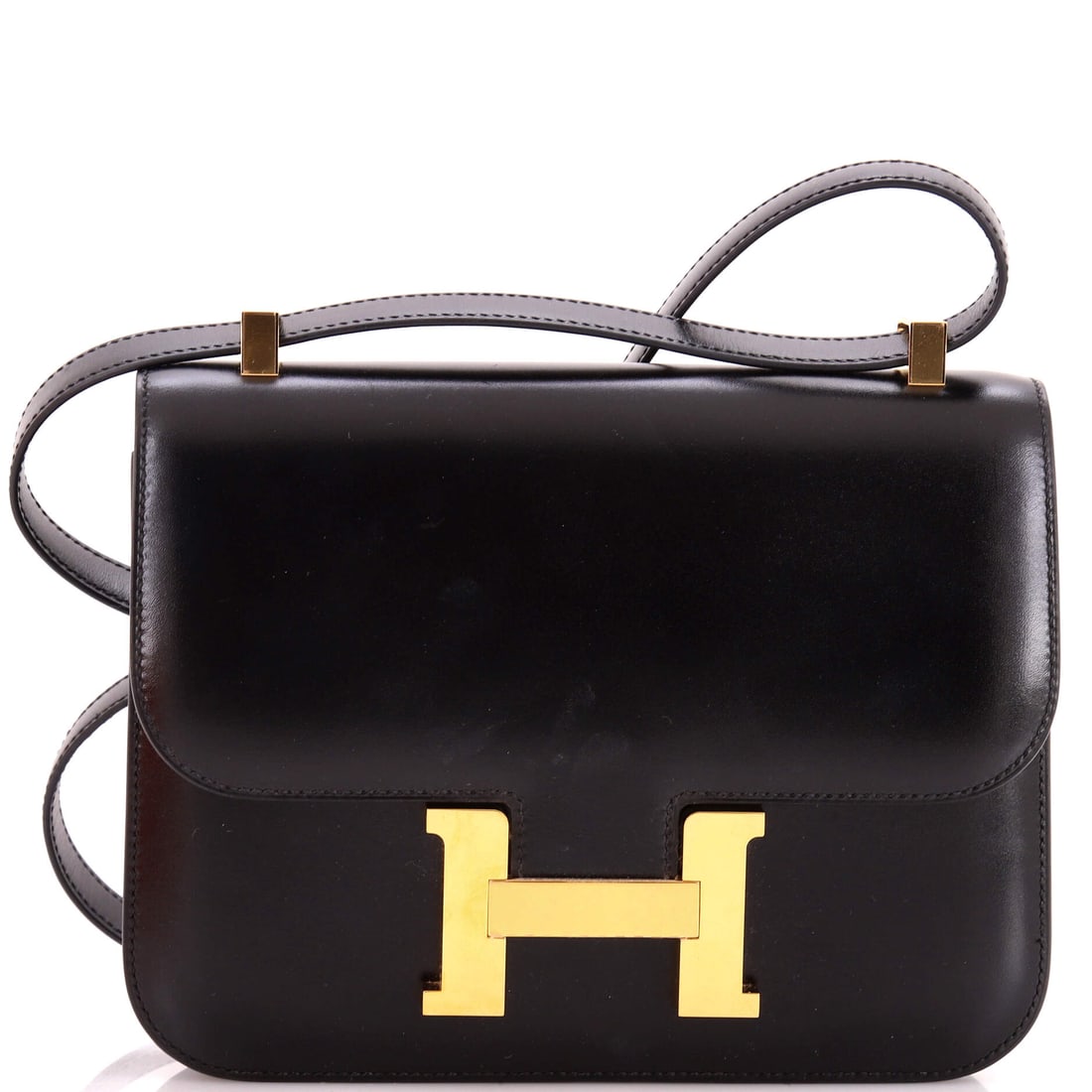 Hermes Constance NM Bag Box Calf: Box Calf develops a patina no current Hermes leather replicates, which is precisely what its collectors want from it. On a Constance NM at 9 in wide, 7 in high and 3 in deep. Grade C - Very Good.