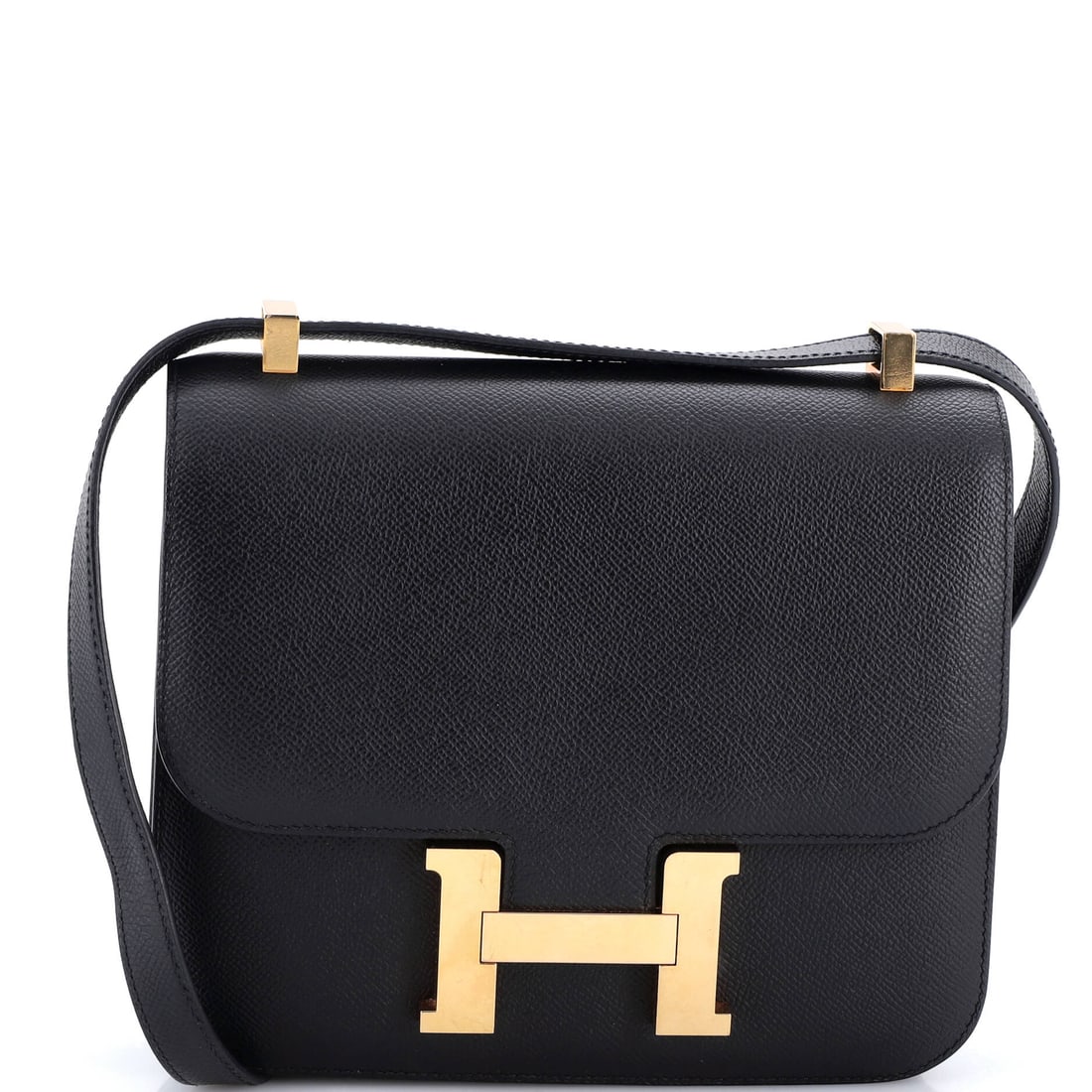 Hermes Constance Bag Epsom: Structured, graphic and convertible between shoulder and crossbody: an Epsom Constance at 9 in wide, 8 in high and 3 in deep. The mid-size Constance carries a phone, a wallet and little else, which