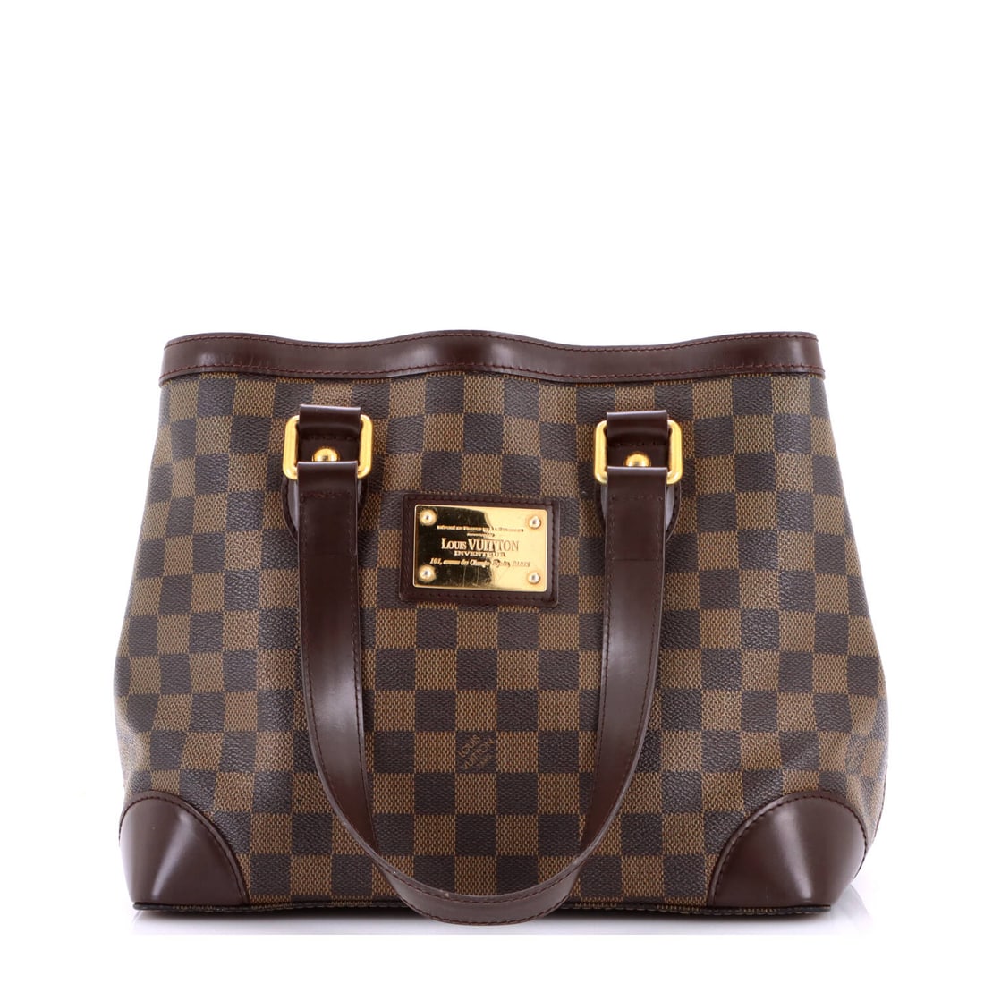 Louis Vuitton Hampstead Handbag Damier: The Hampstead Handbag in Damier, an upright tote with a flat base and slim straps. It stands upright on a floor, which is a small thing until you need it. Scale is 11" W by 9" H by 7" D. Shows as